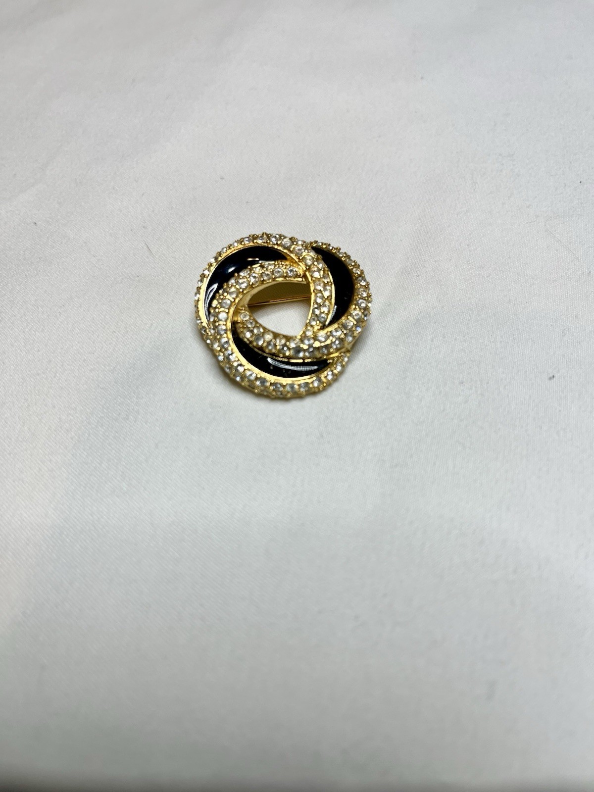 Signed Swarovski Gold Tone Clear Crystal Black Enamel Love Knot Brooch Pin