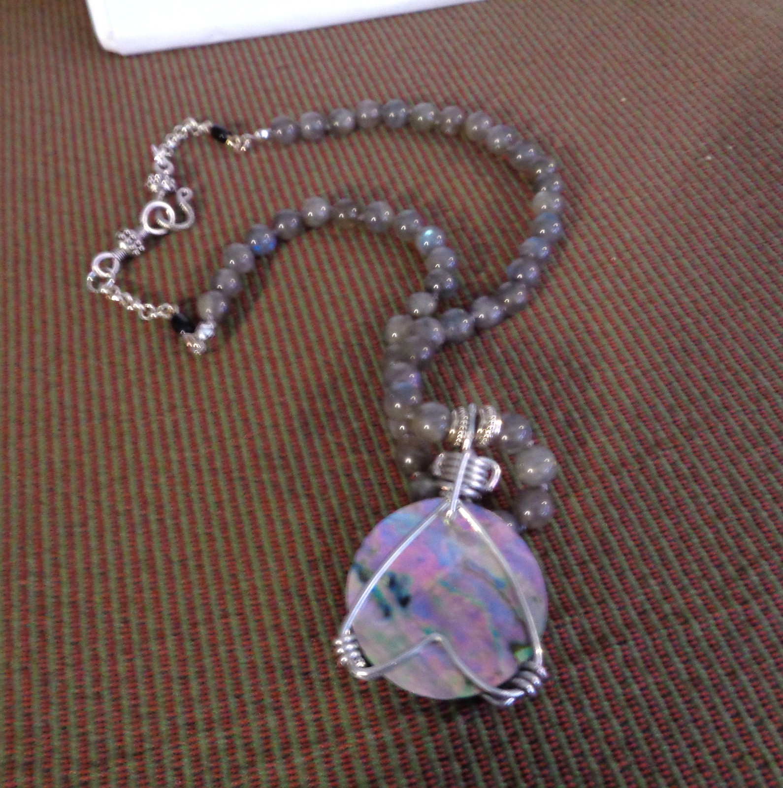 Artisan crafted, gorgeous, aluminum wrapped Paua pendant, on 19” Labradorite str