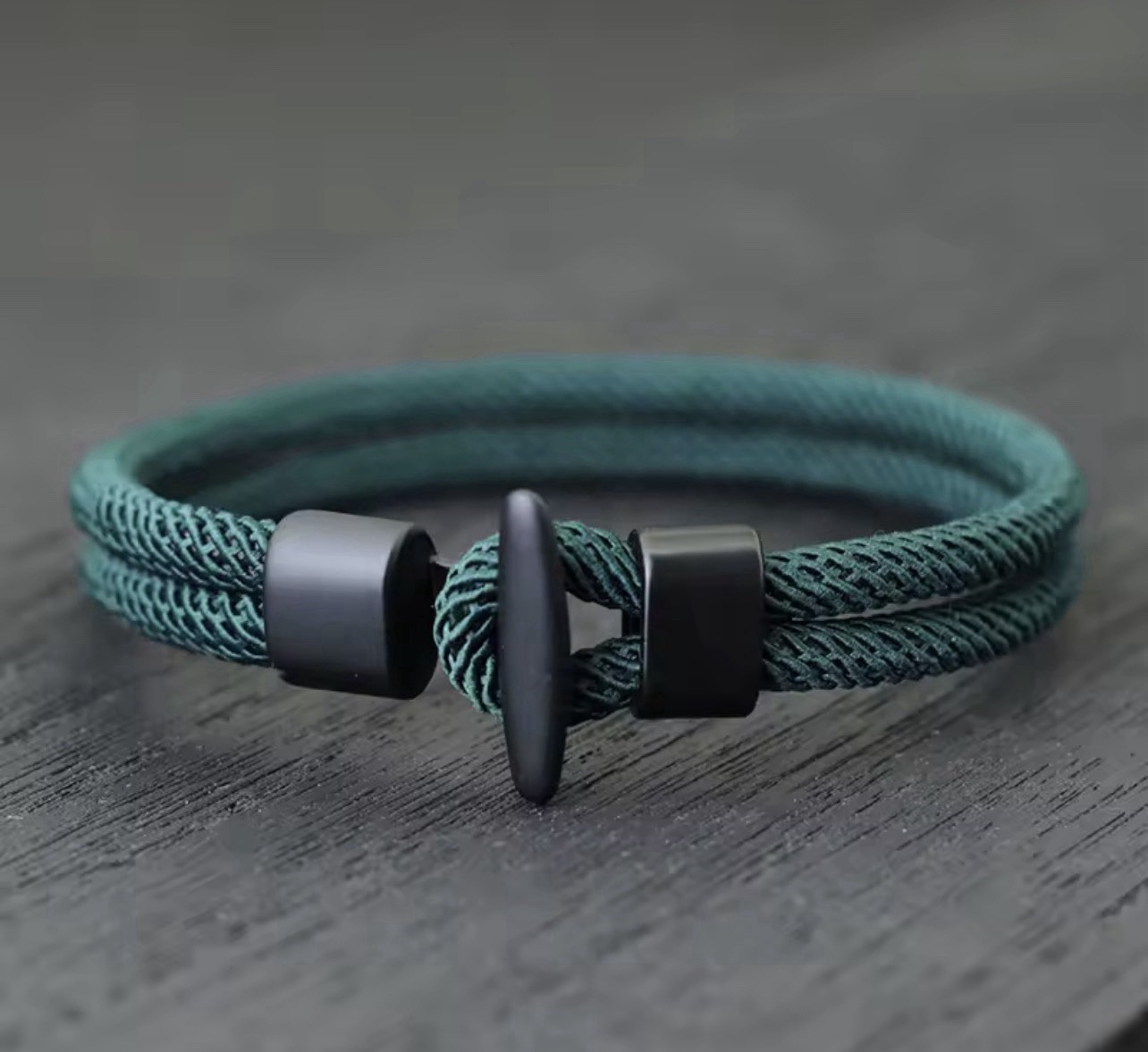 Men’s green and black braided nylon rope bracelet, adjustable, toggle clasp