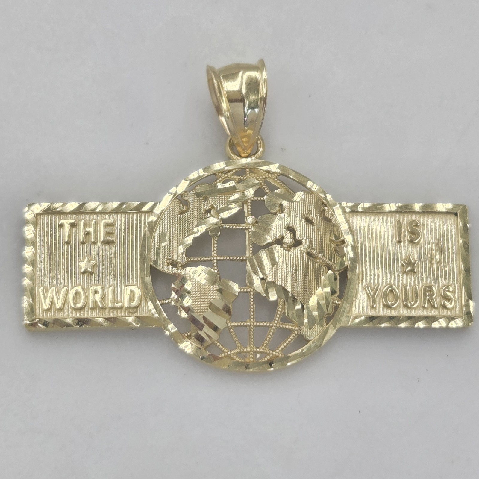 10k Yellow Gold The World Is Yours pendant