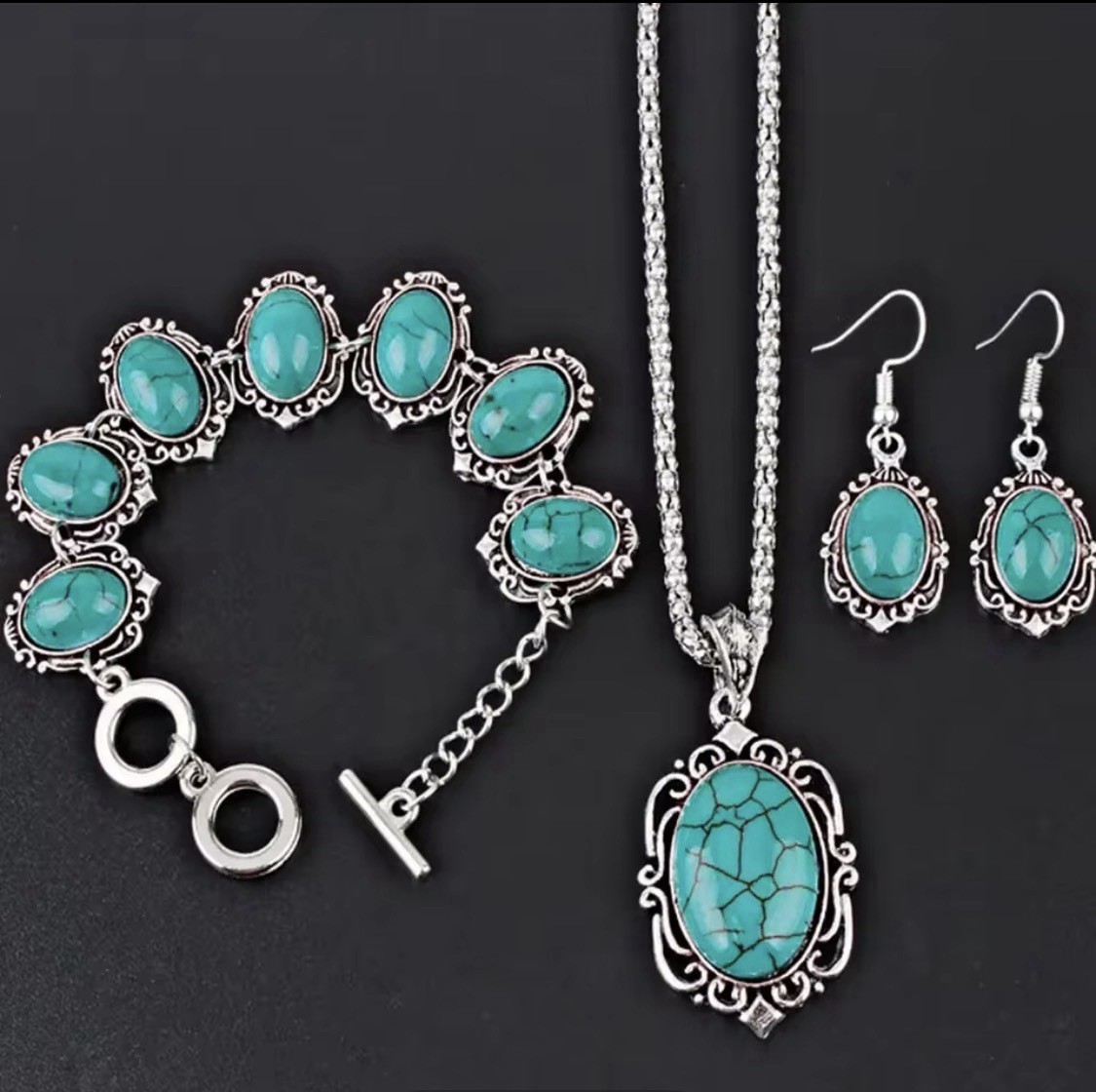 The jewelry set includes a matching necklace, earrings, and bracelet,