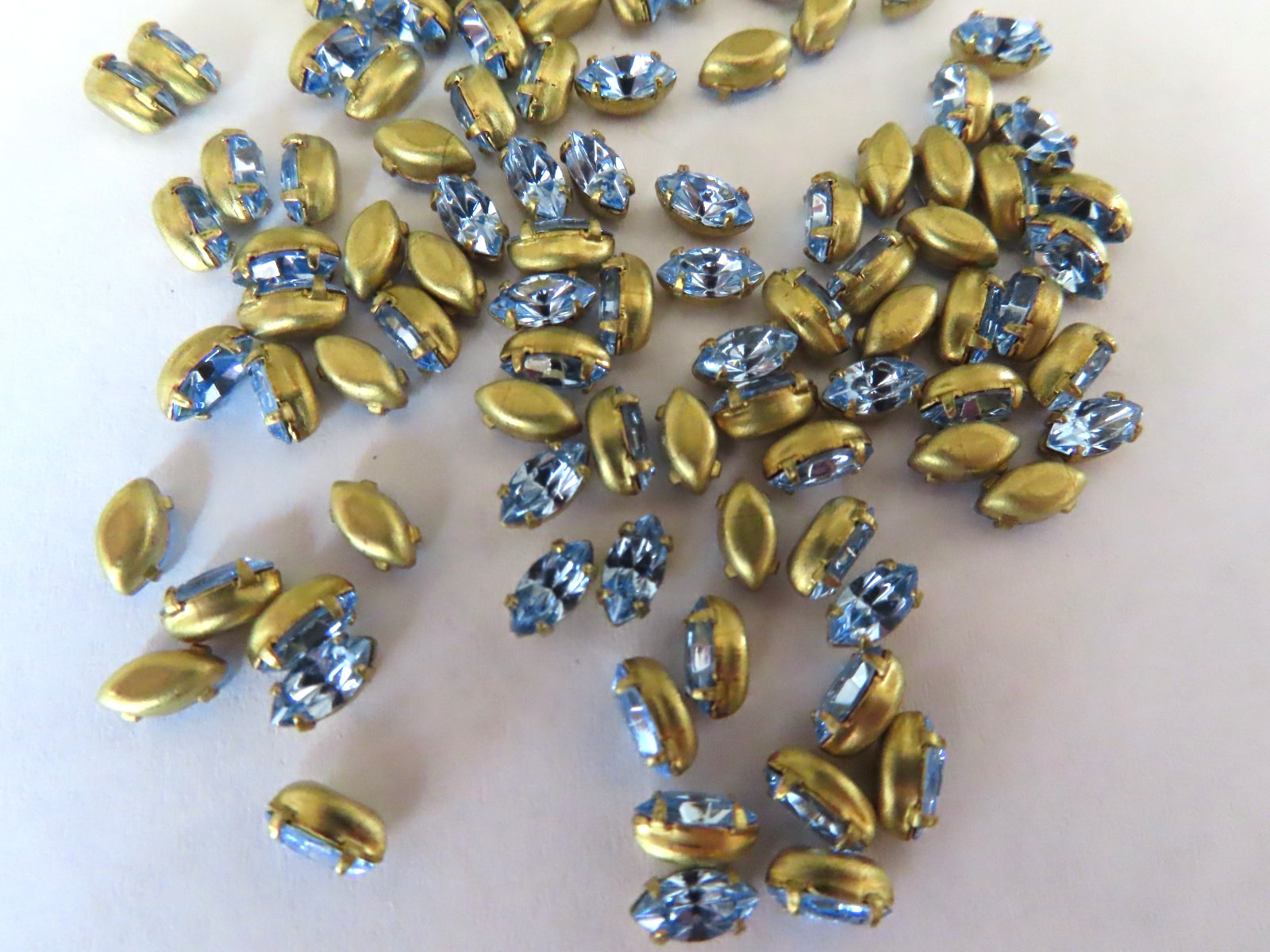 144 Swarovski Navette Rhinestones 6x3mm Light Sapphire/Brass settings.