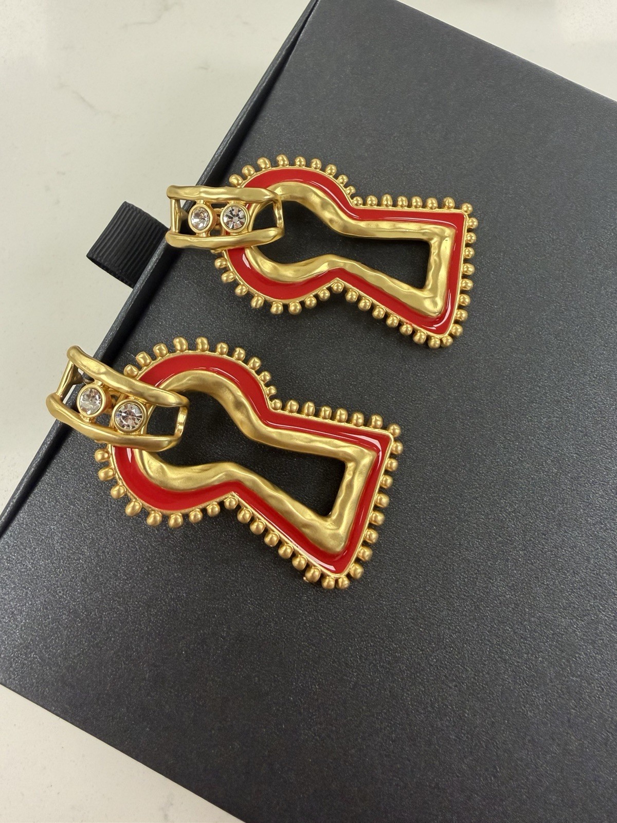 Surrealist, Schiaparelli style, keyhole stud earrings, gold with red enamel
