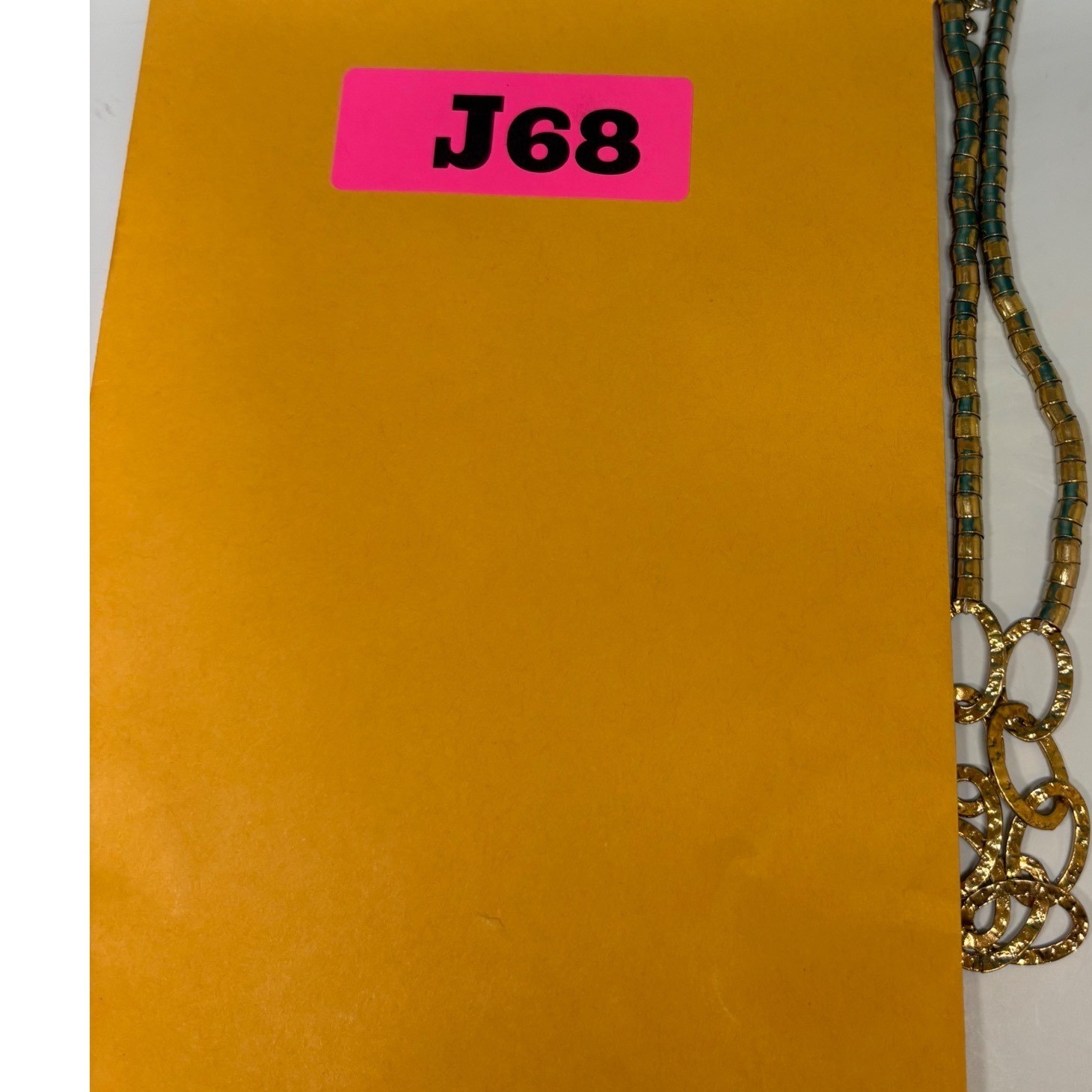 V Logo Gold Tone Hammered Oval Link Segmented Tube Statement Necklace