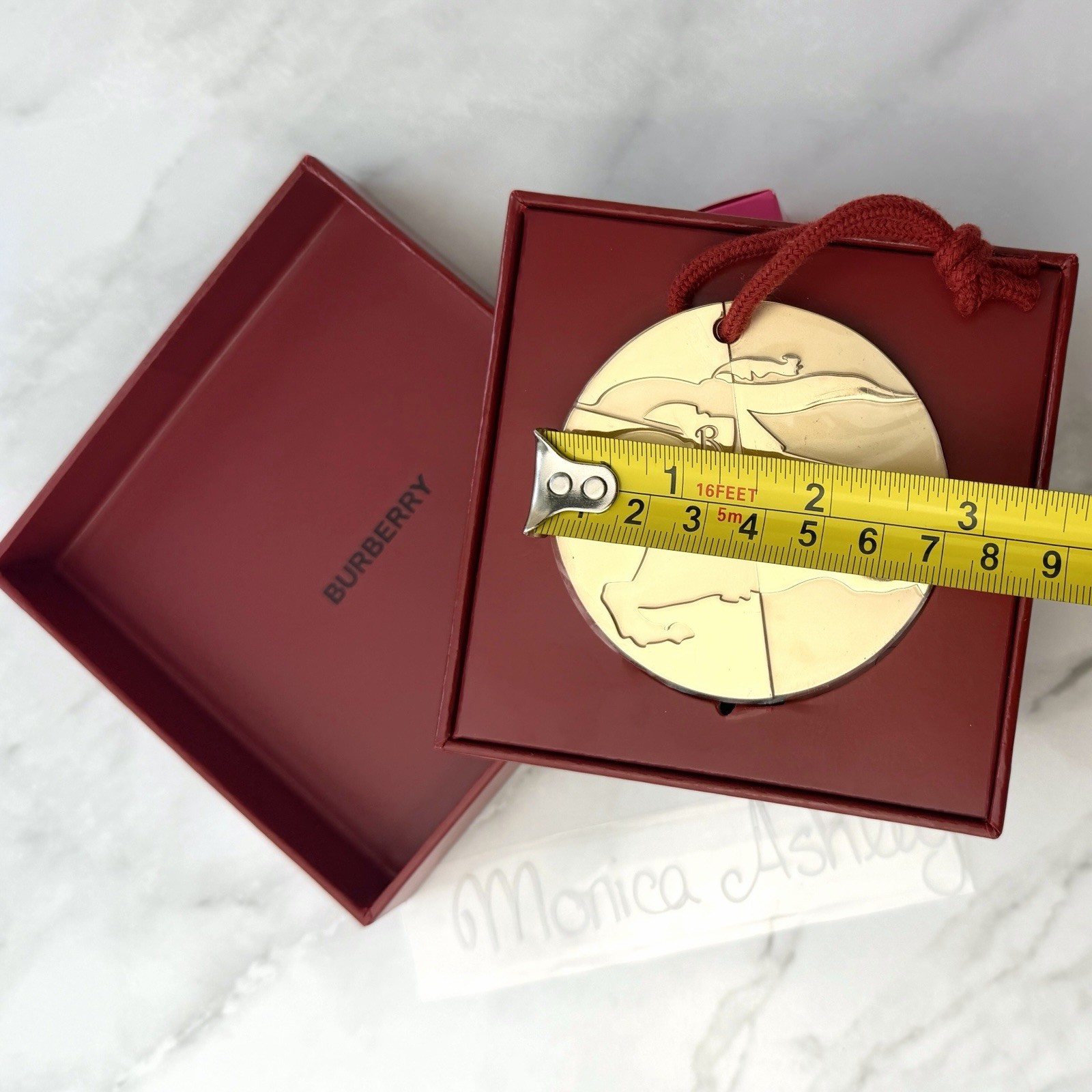Burberry Metal Gold-Tone Round Brand Engraved Medallion Pendant Ornament, NIB