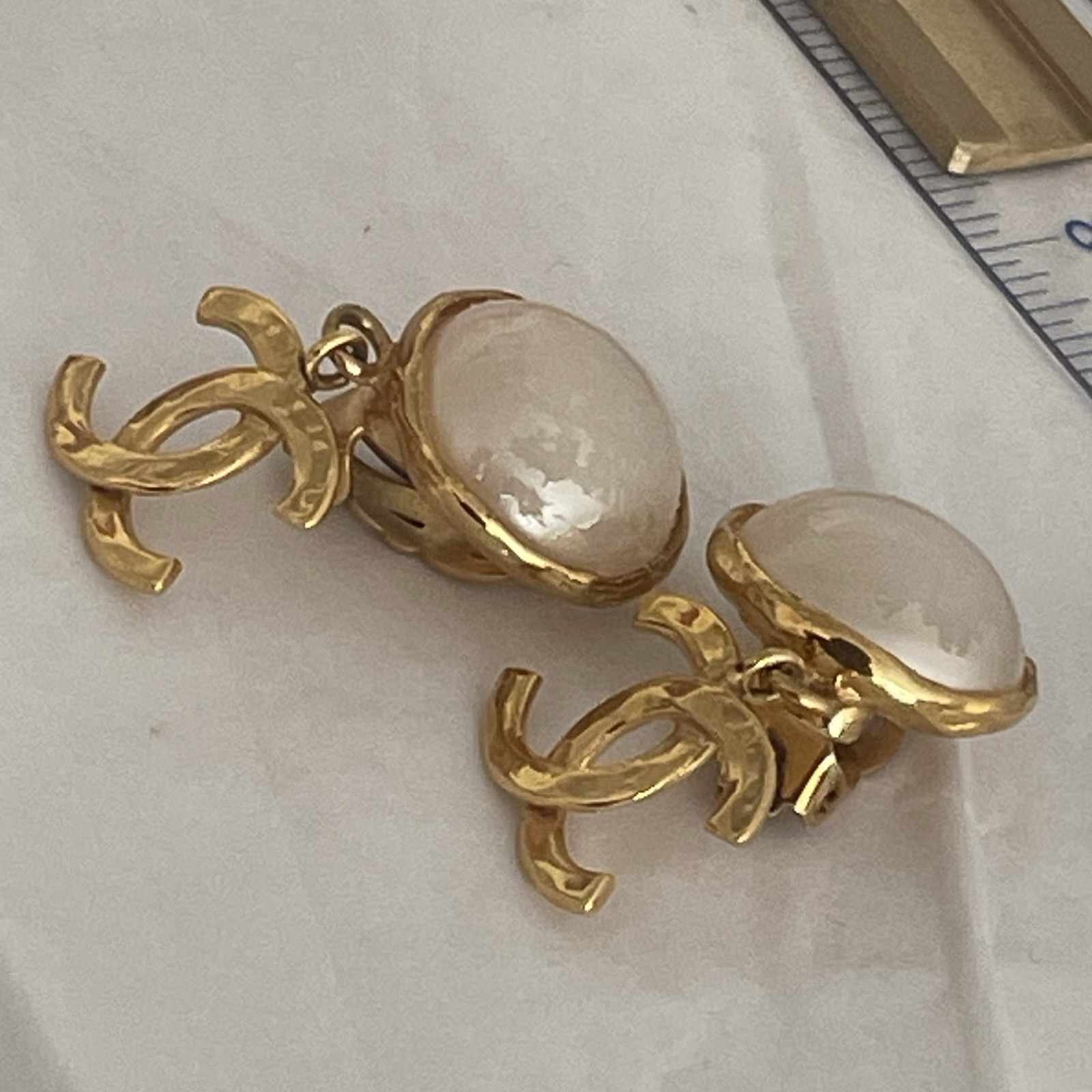 Auth. vtg CHANEL 1995 gold 3D CC logo dangle with round moonlight stone stamped