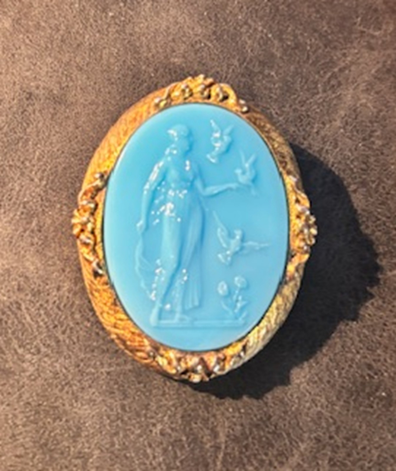 Antique Blue Cameo Brooch with classical figure in an ornate gold-tone frame