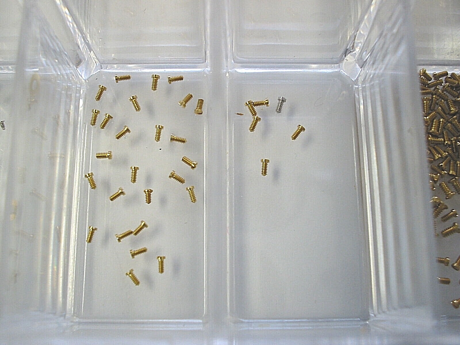 Choose any 4 new Piaget gold case back screws .70 mm / .90 mm. Other sizes too