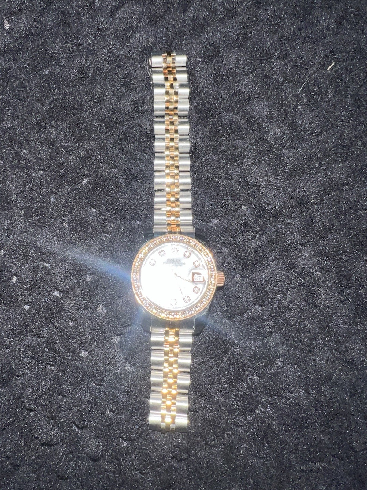 This watch is a 28 mm Rolex Lady-Datejust, model 279381RBR with diamonds