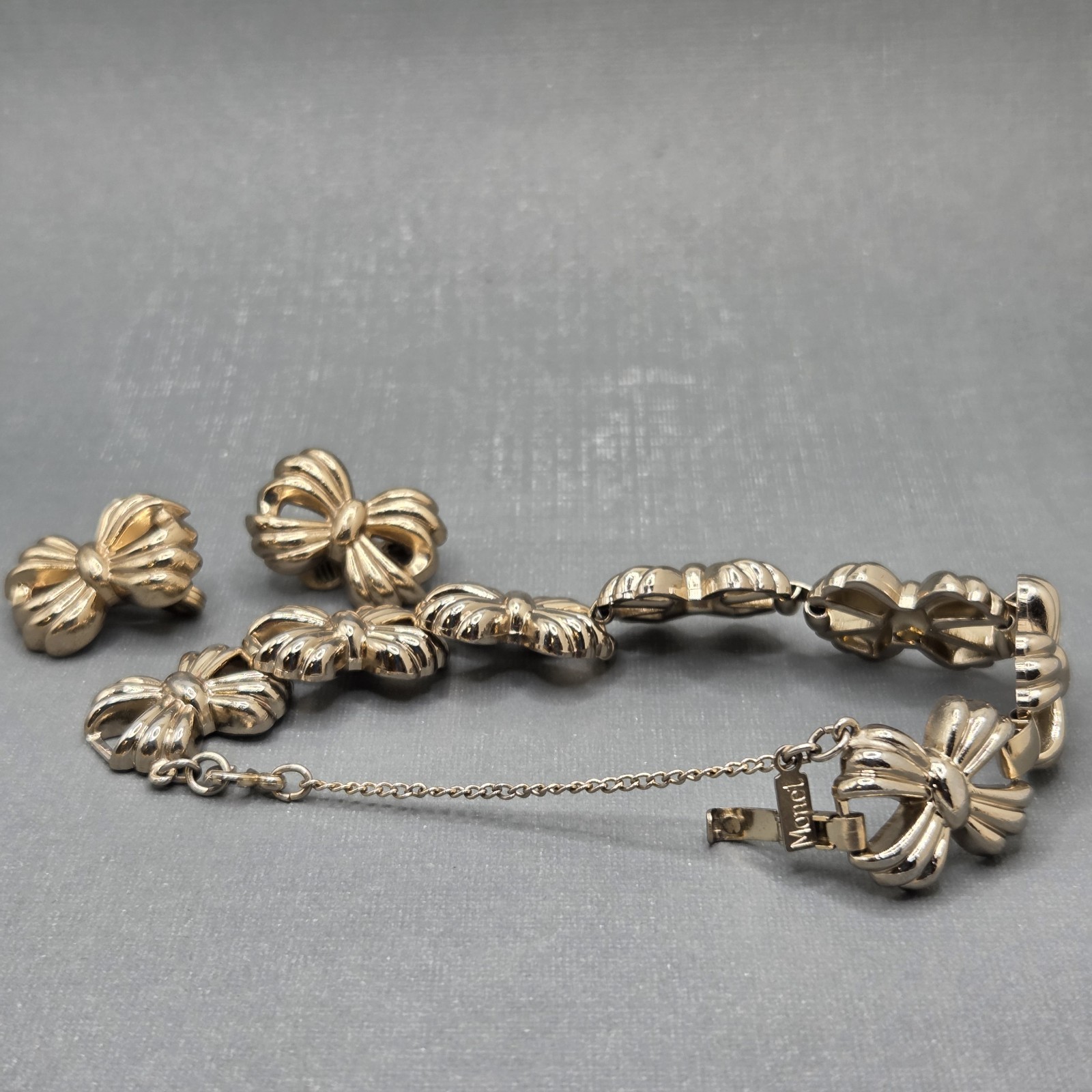 Vintage Monet Gold Tone Bow Bracelet Safety Chain And Clip On Earrings Set SEE