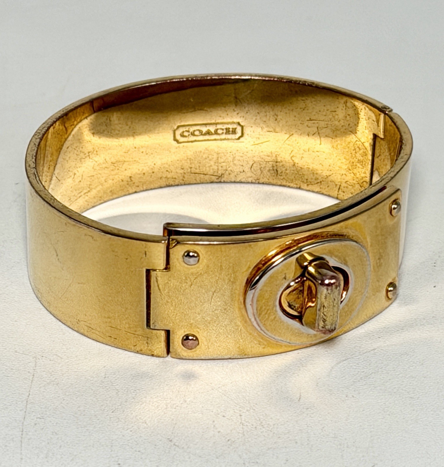 Coach Shiny Gold Turn Lock Bracelet Bangle Opens closes 3/4″ Thick