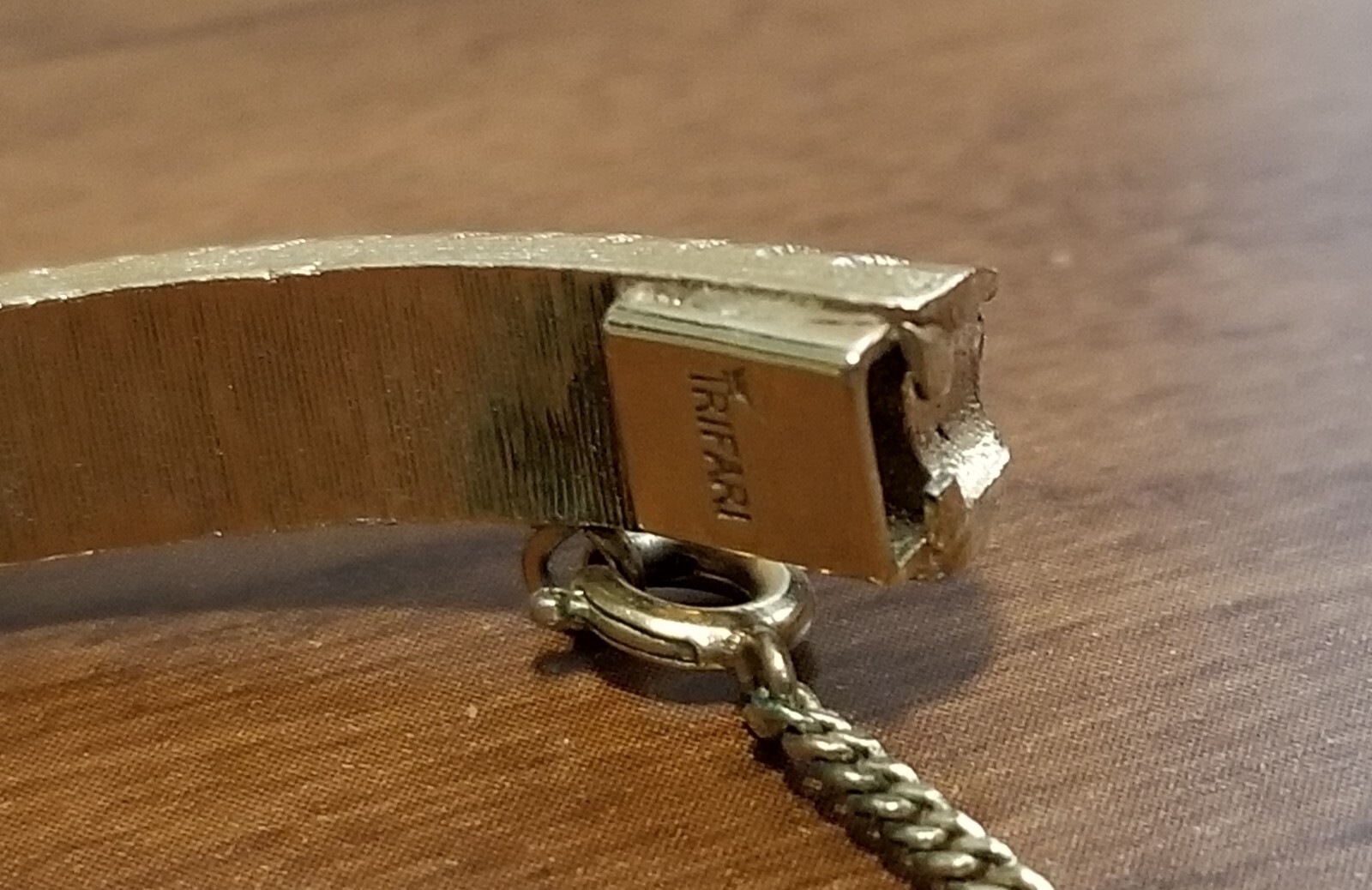 Vintage Crown Trifari Gold Hinged Bangle Bracelet With Safety Chain.