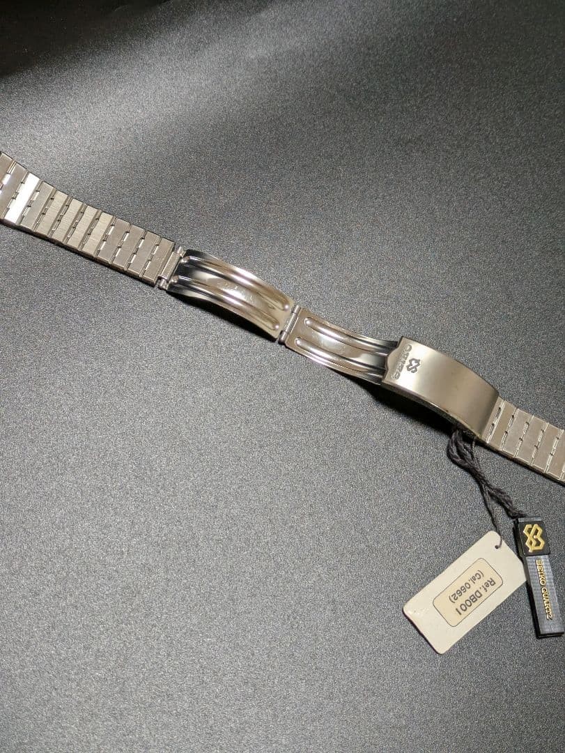 SEIKO stainless steel simple metal band with tag.