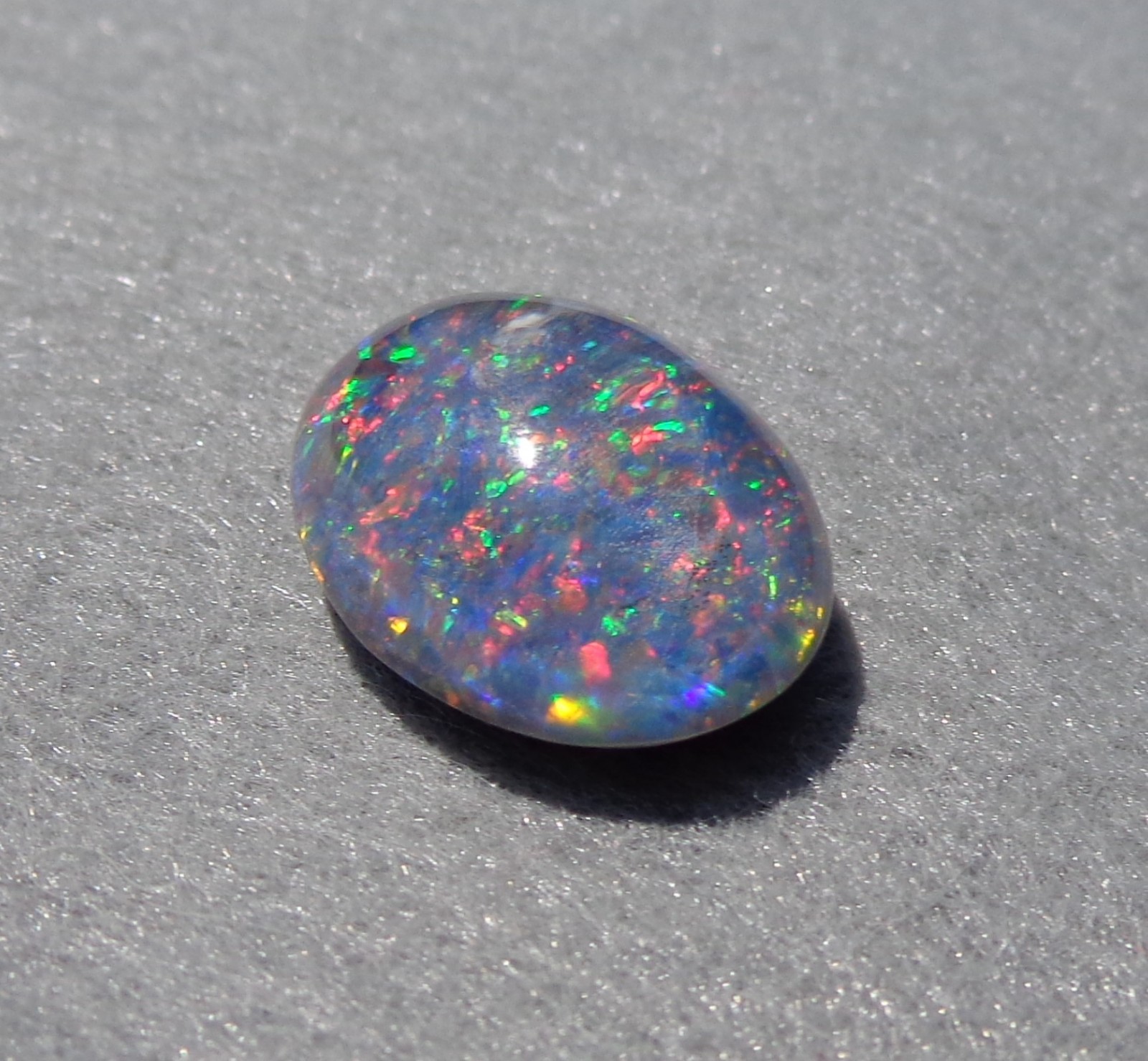 Spencer Idaho Opal Triplet 15X20 mm a Glitter Dome of Red & Green Flecks of Fire