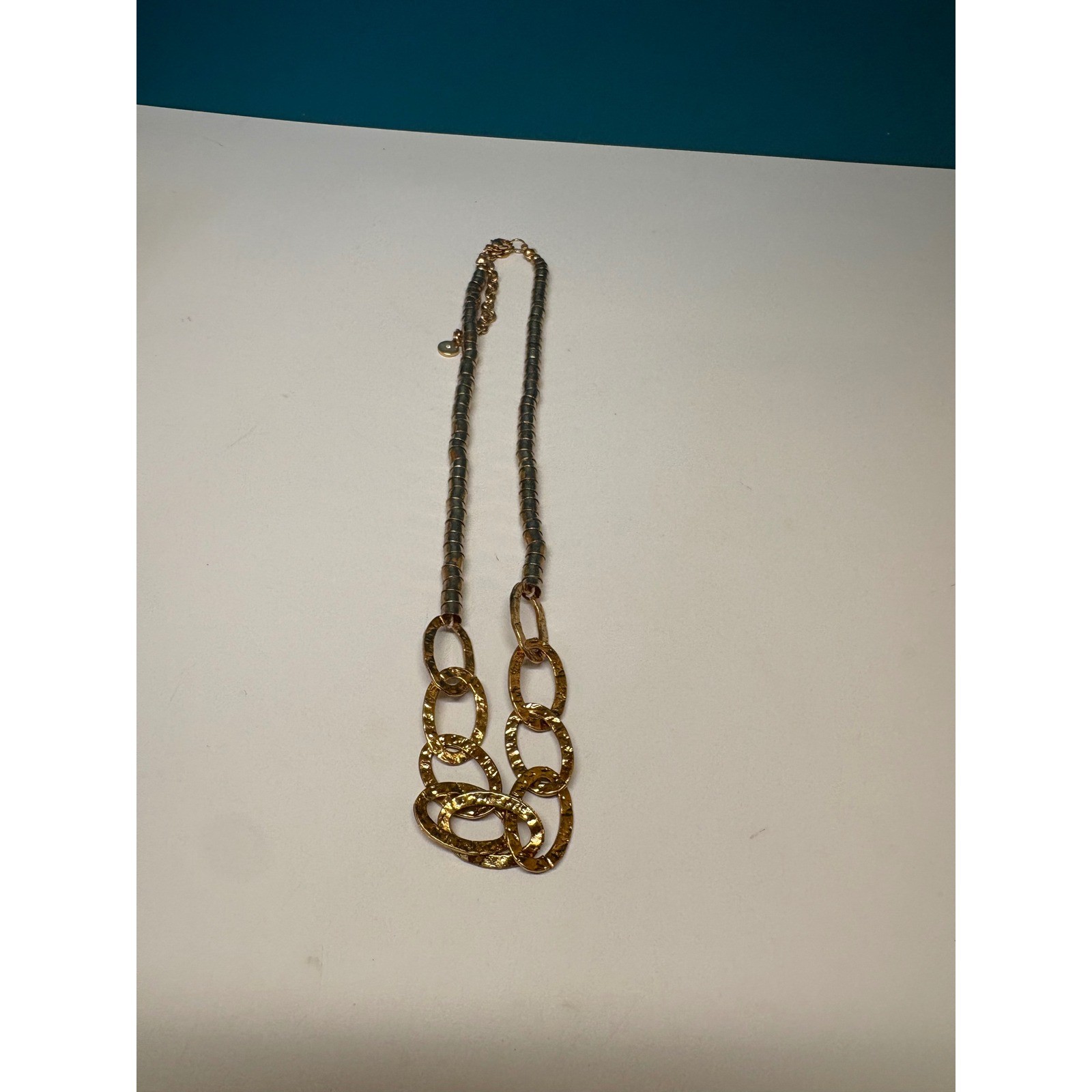 V Logo Gold Tone Hammered Oval Link Segmented Tube Statement Necklace