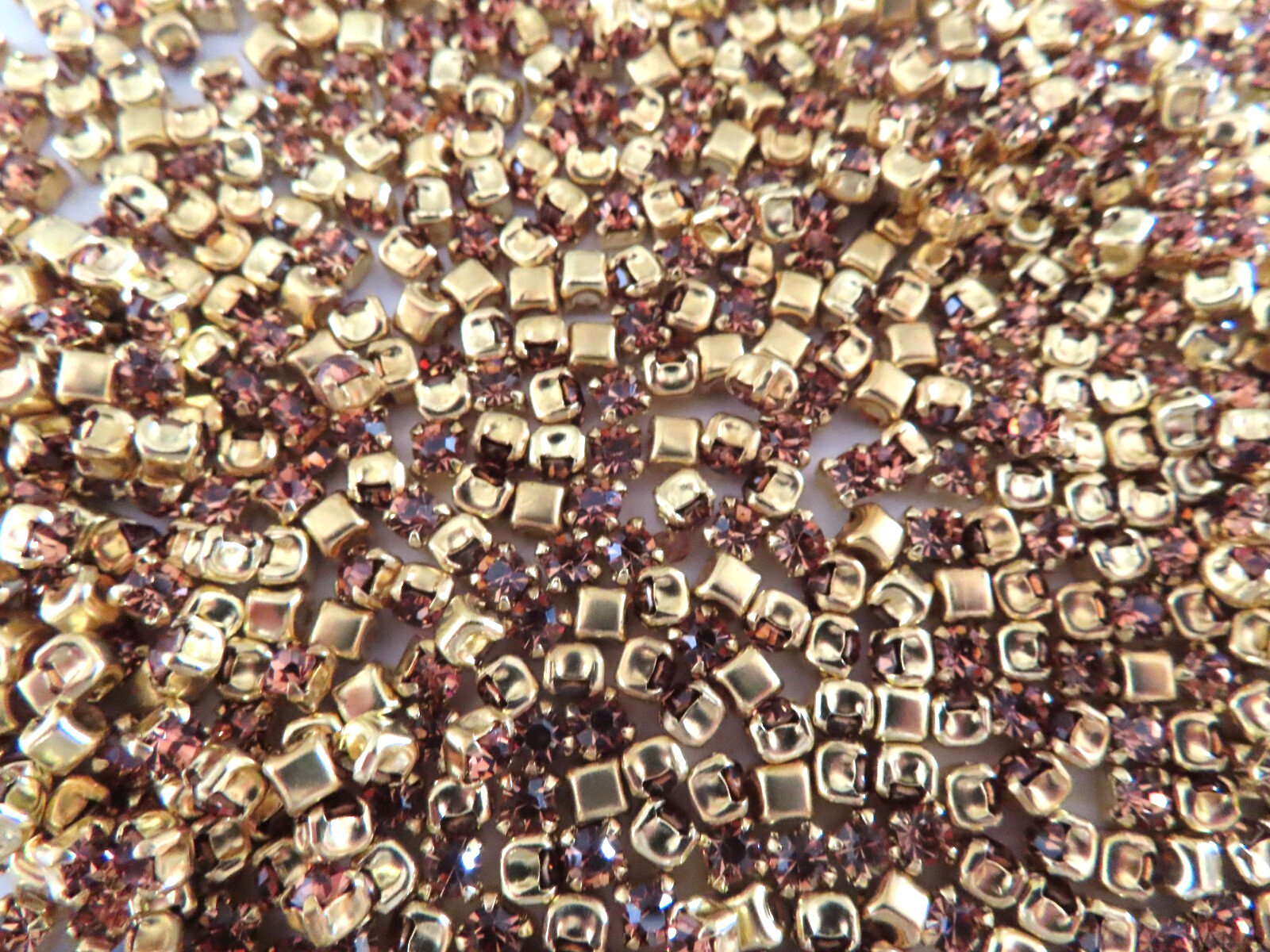 720 Swarovski Rhinestones 24pp Light Smoked topaz/brass settings.