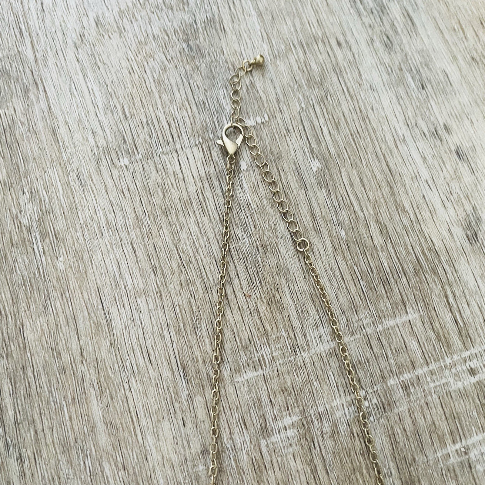 Gold Double Ring Pendant Necklace with Black and Gray Beads