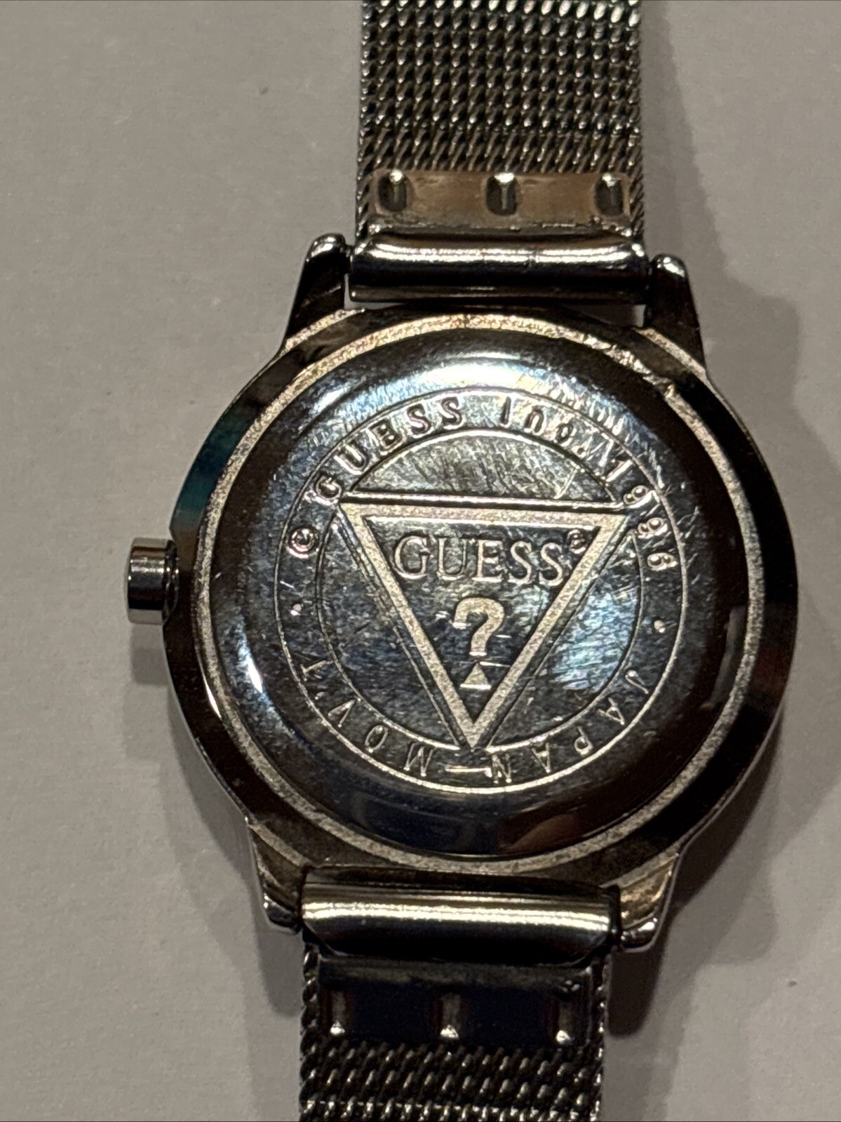 1996 GUESS numberless face watch. silver w adjustable mesh band. new battery.