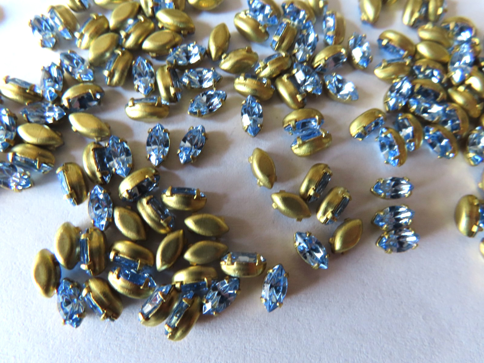 144 Swarovski Navette Rhinestones 6x3mm Light Sapphire/Brass settings.