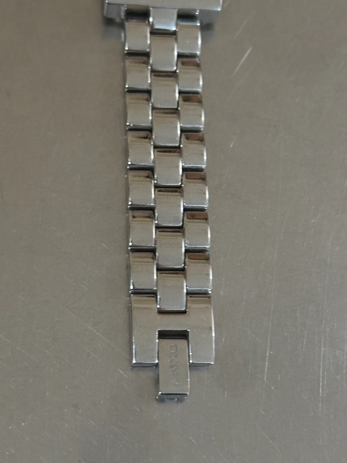 DKNY Watch Women’s Analog Square Silver Tone Quartz Water Resistant 7 inch 22 mm