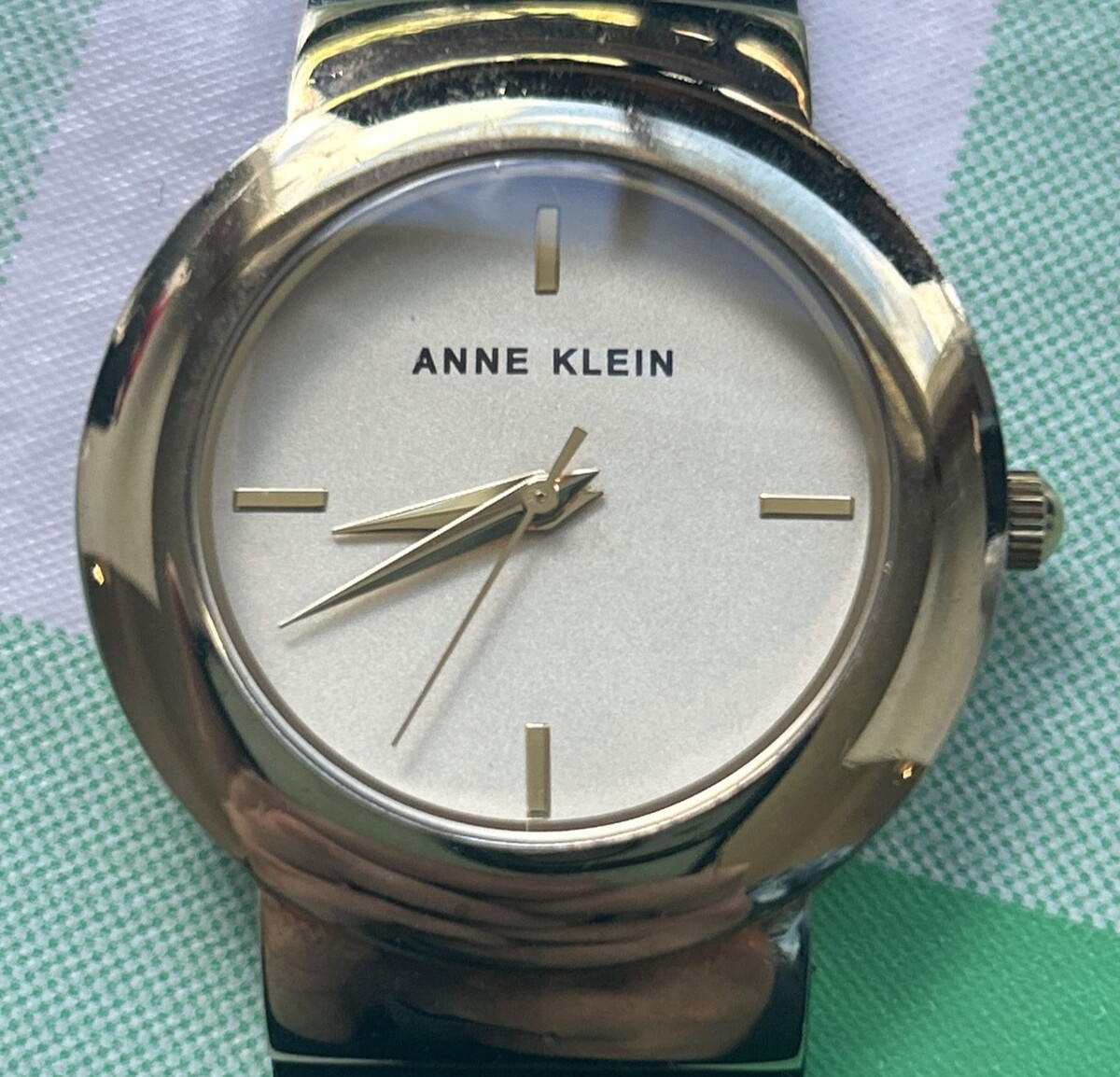 Anne Klein AK/2922 Gold Tone Dial Black Leather Strap Women’s Watch