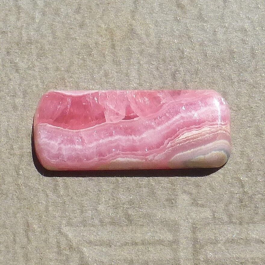 Pink w/calcite banding natural Rhodochrosite cabochon Argentina (27.60 carats)