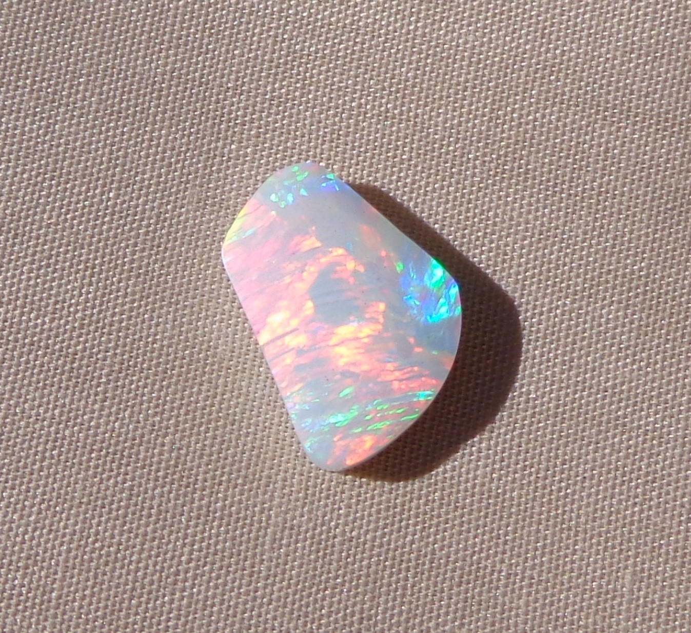 Spencer Idaho Opal Solid 9X15 mm with Unique Pattern and Red, Green, & Gold Fire