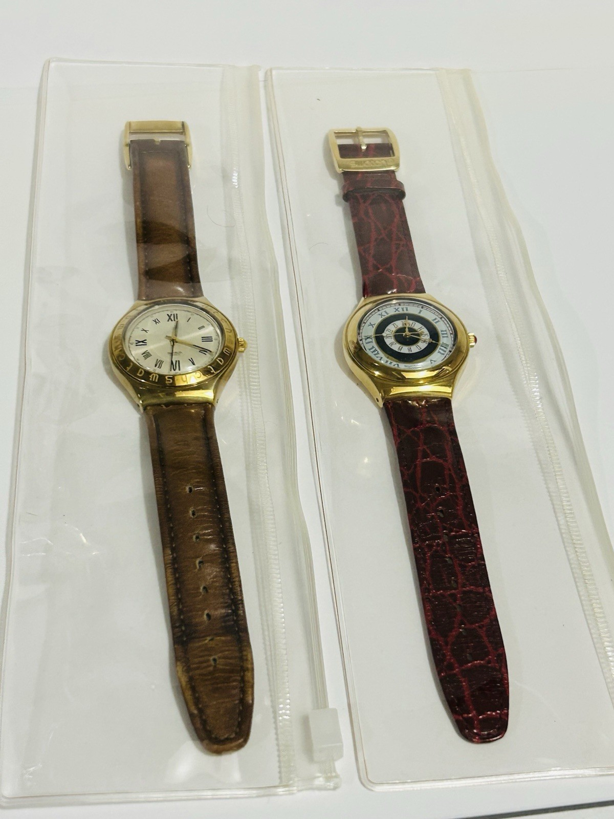 Swatch Swiss Lot of 2 Quartz Gold Tone Roman Dial Leather Strap Watches