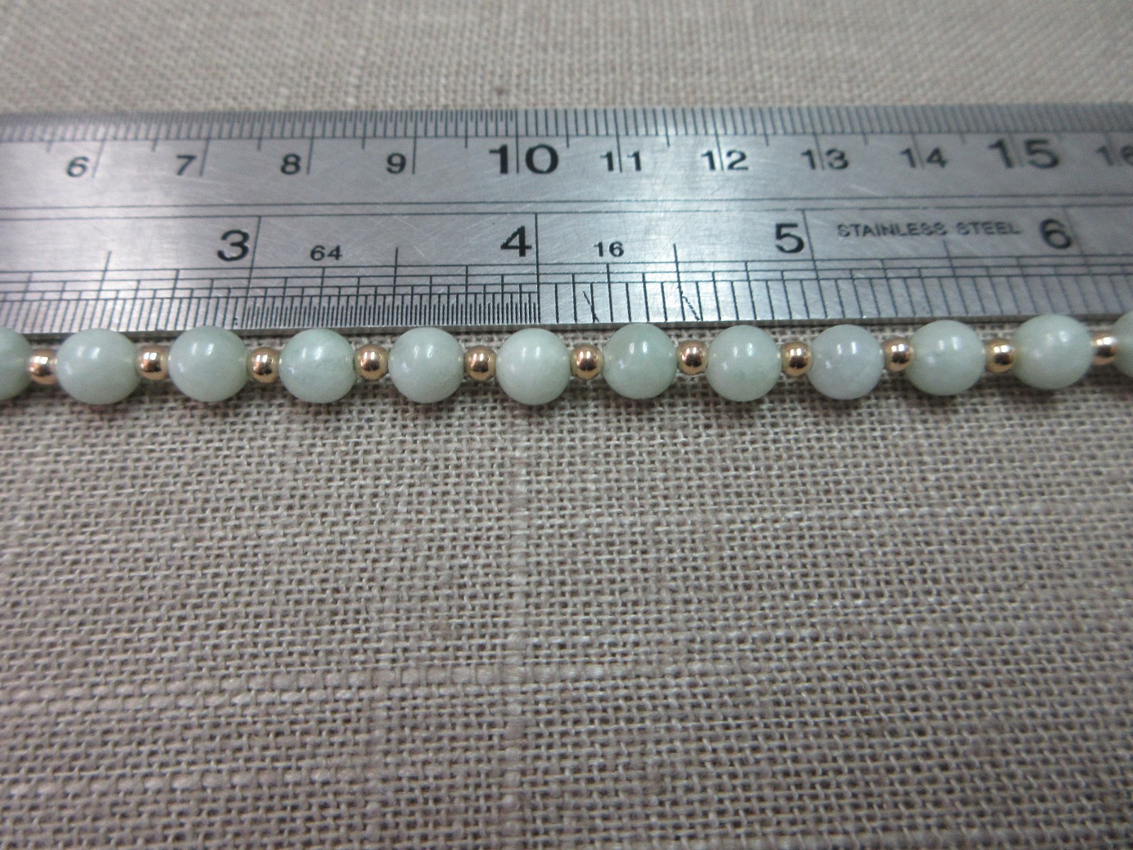 6 7/8″ 14k Foam Green Jade Beads 14k gold beads Bracelet 8.22 Grams