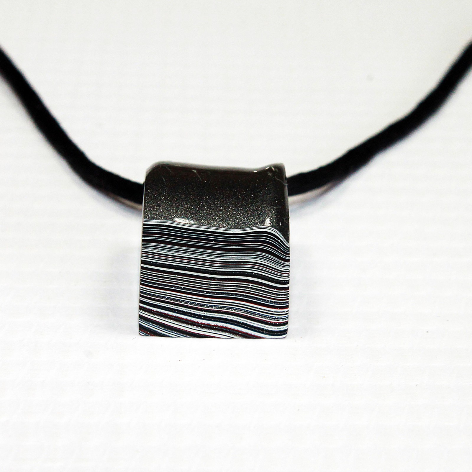 Fordite Necklace – 18.35mm x 15.2mm x 12.83mm – Black Leather Rope (N-019)