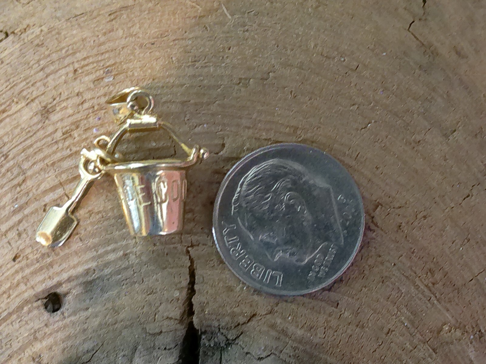 marked 14K GOLD CHARM CAPE COD PAIL & SHOVEL SAILBOAT ON BACK SIDE 2.4 GRAMS