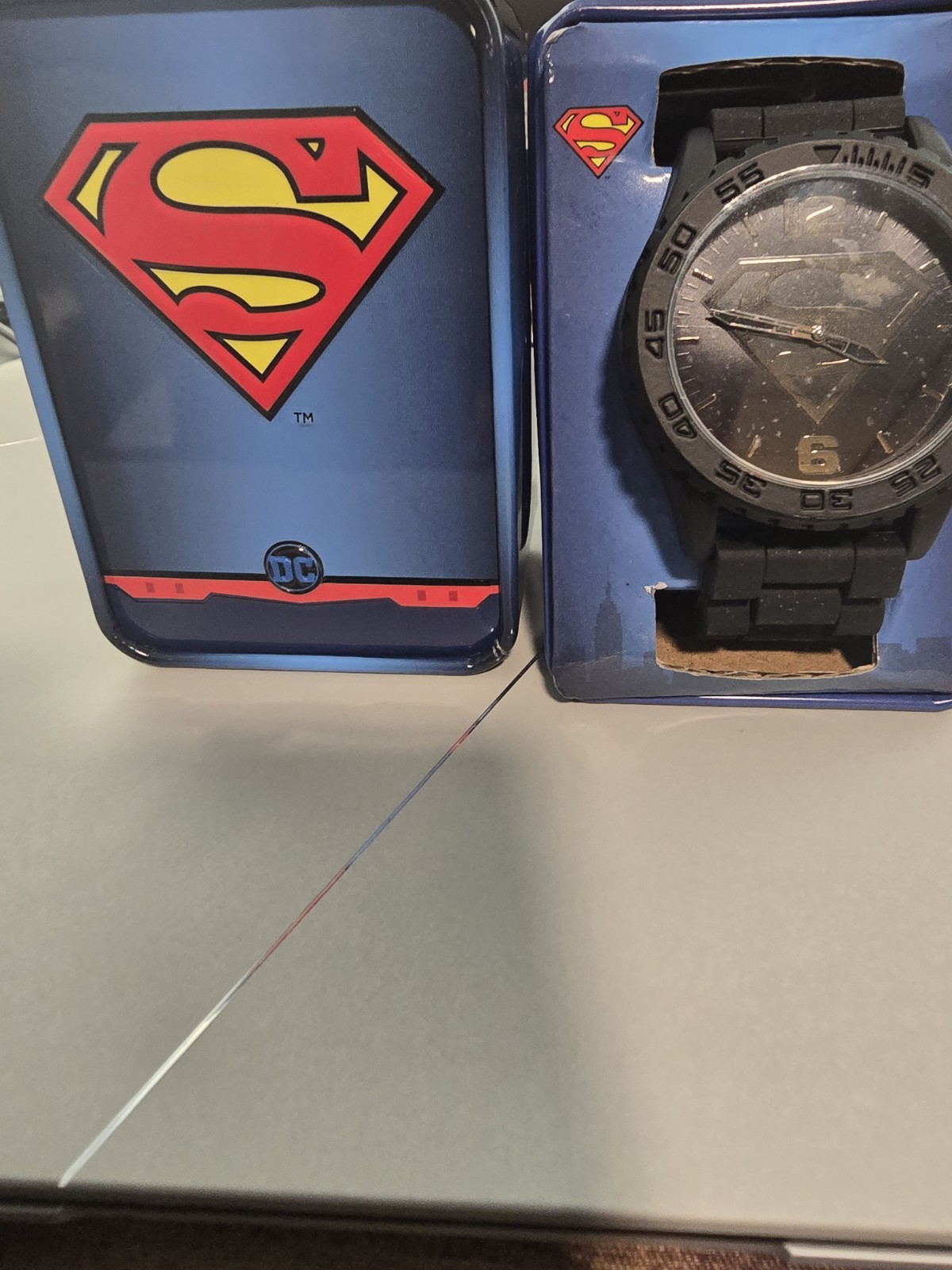 Accutime Superman Men’s Quartz Analog Black Dial Silicone Strap w/ Tin Box