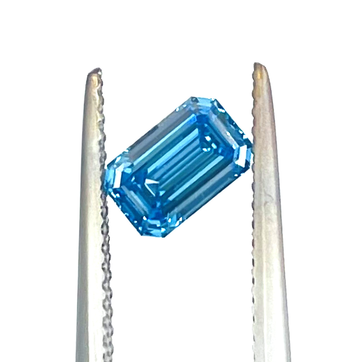 0.78 Carat Fancy VIvid Blue Diamond GIA Certified VS1 Emerald Cut