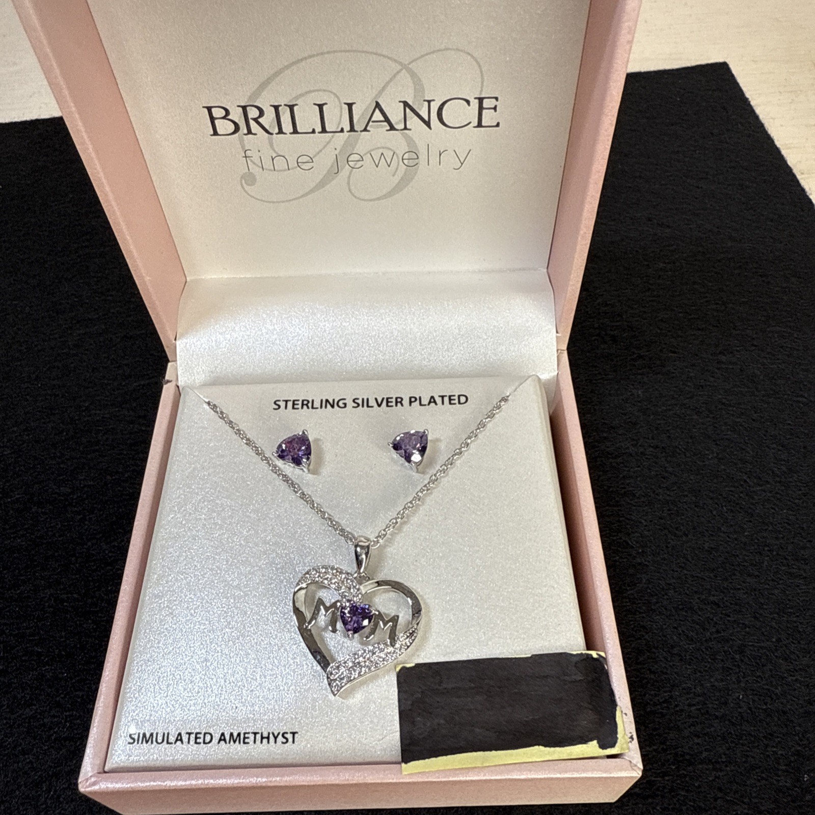 Brilliance fine jewelry necklace and earrings with the word “mom”