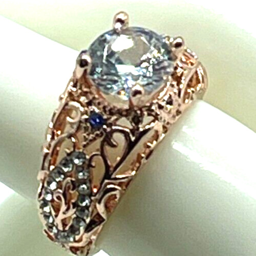 Ring Rose Gold Clear Center Crystal, Clear & Blue small crystal accents. Sz 6