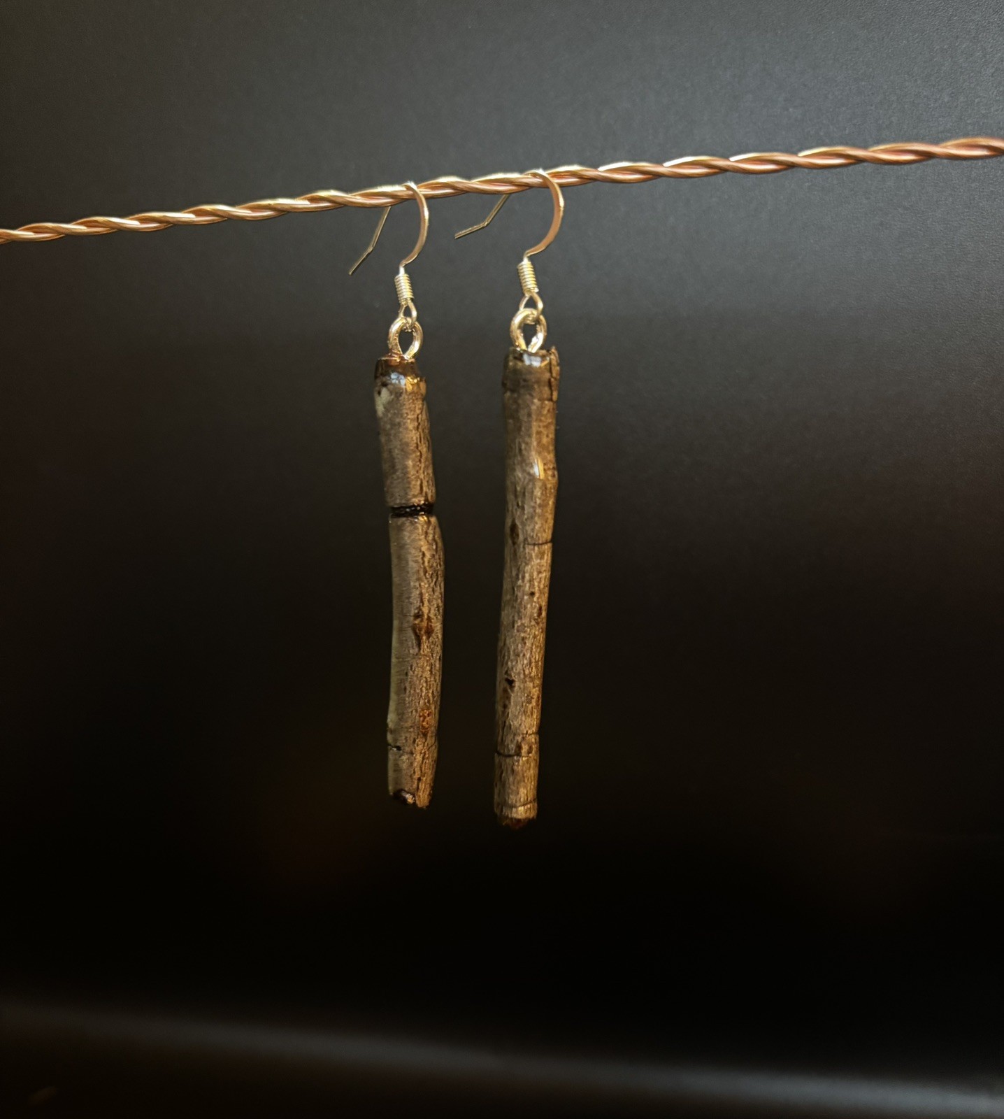 One of a kind jewelry made from real pieces of wood coated in resin