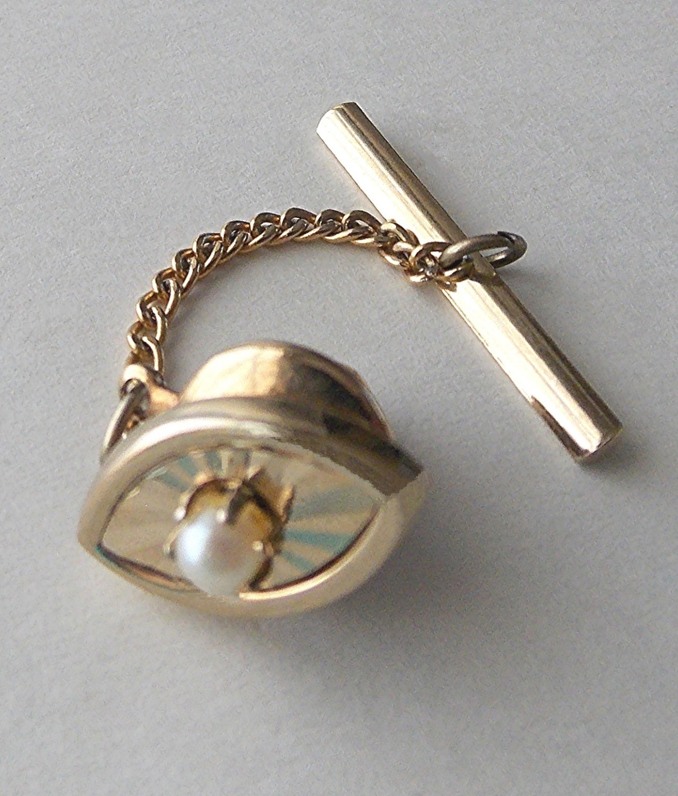 VTG. 40’s SWANK STAMPED “S” IN A PENTAGON GOLD PLATED FAUX PEARL CENTER TIE TACK