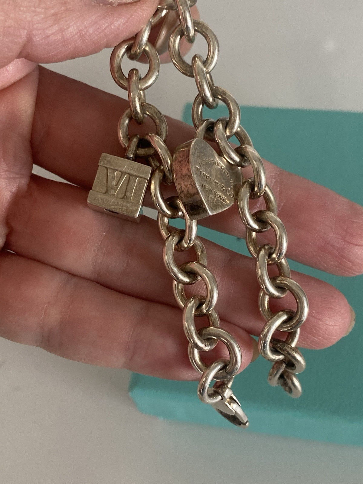 Tiffany & Co. Sterling Silver Charm Bracelet with 2 Charms Length 71/2 Inches