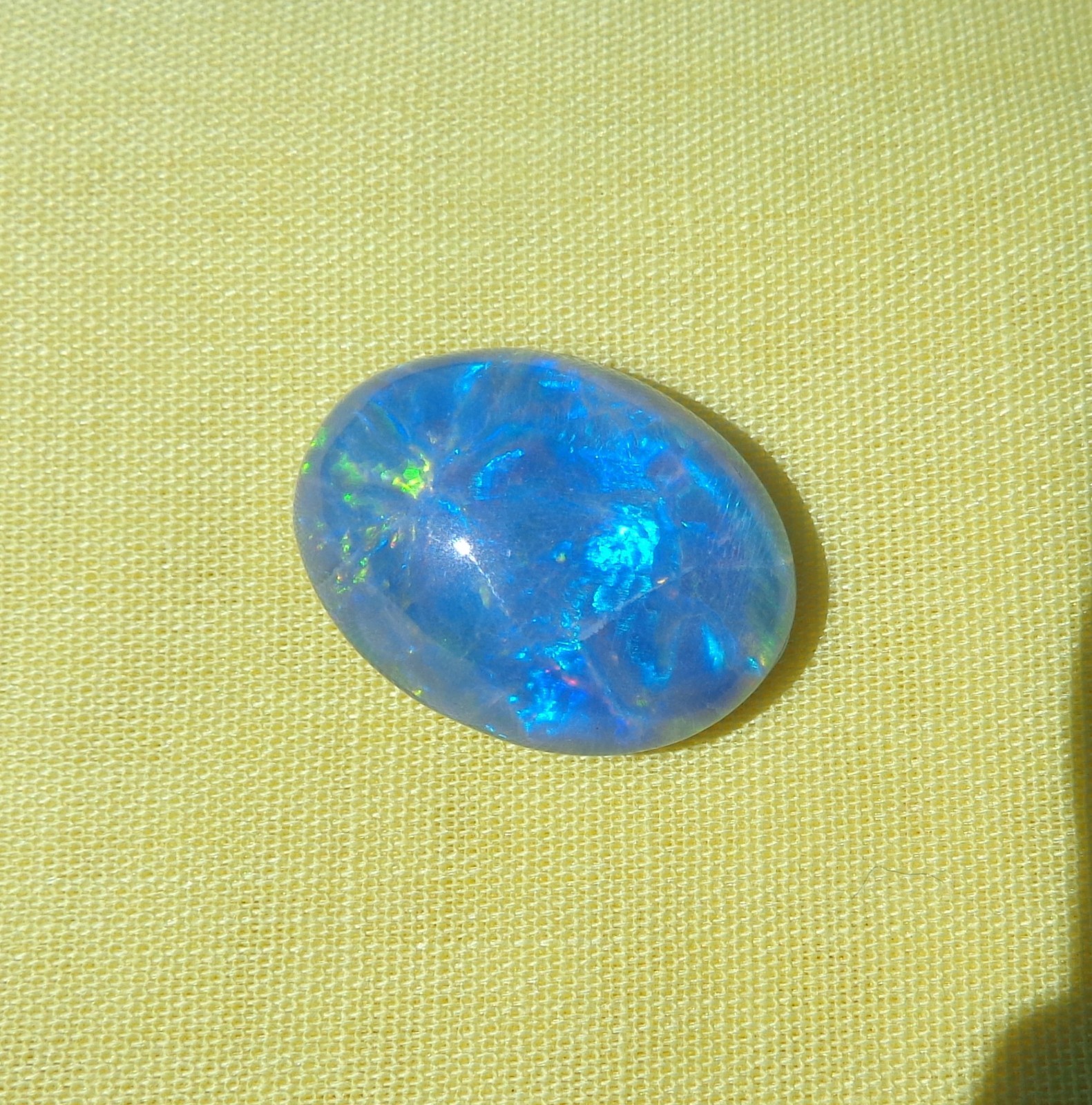 Spencer Idaho Opal Triplet 15X20mm with a Blazing Green Fire in a Galaxy Pattern