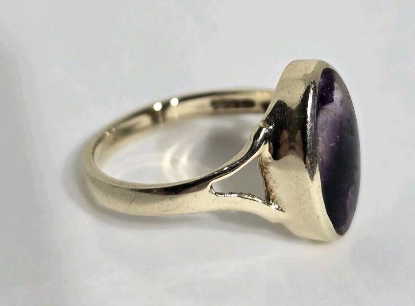 9ct Yellow gold open work ring. Collet set with an oval Blue John Cabochon.
