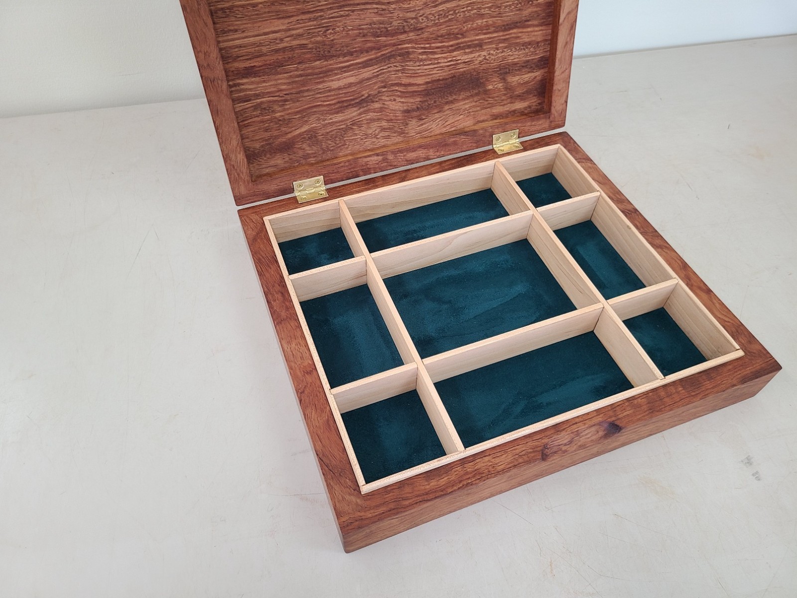 a beautiful bubinga jewelry/valet box. Made of solid bubinga with maple dividers