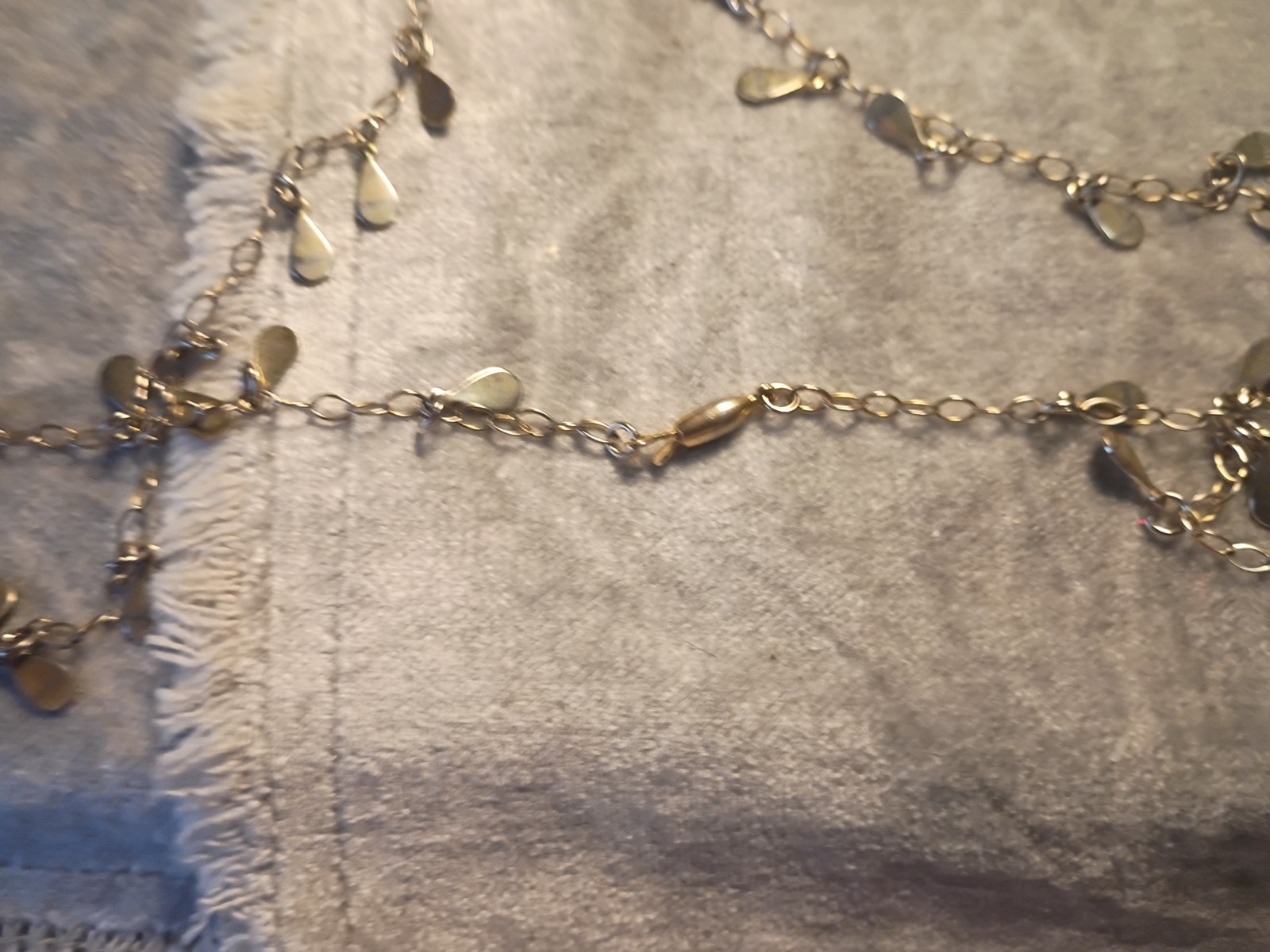 Gold Toned Tear Drop Charmed 56 Inch Taper Single Strand Necklace. J2