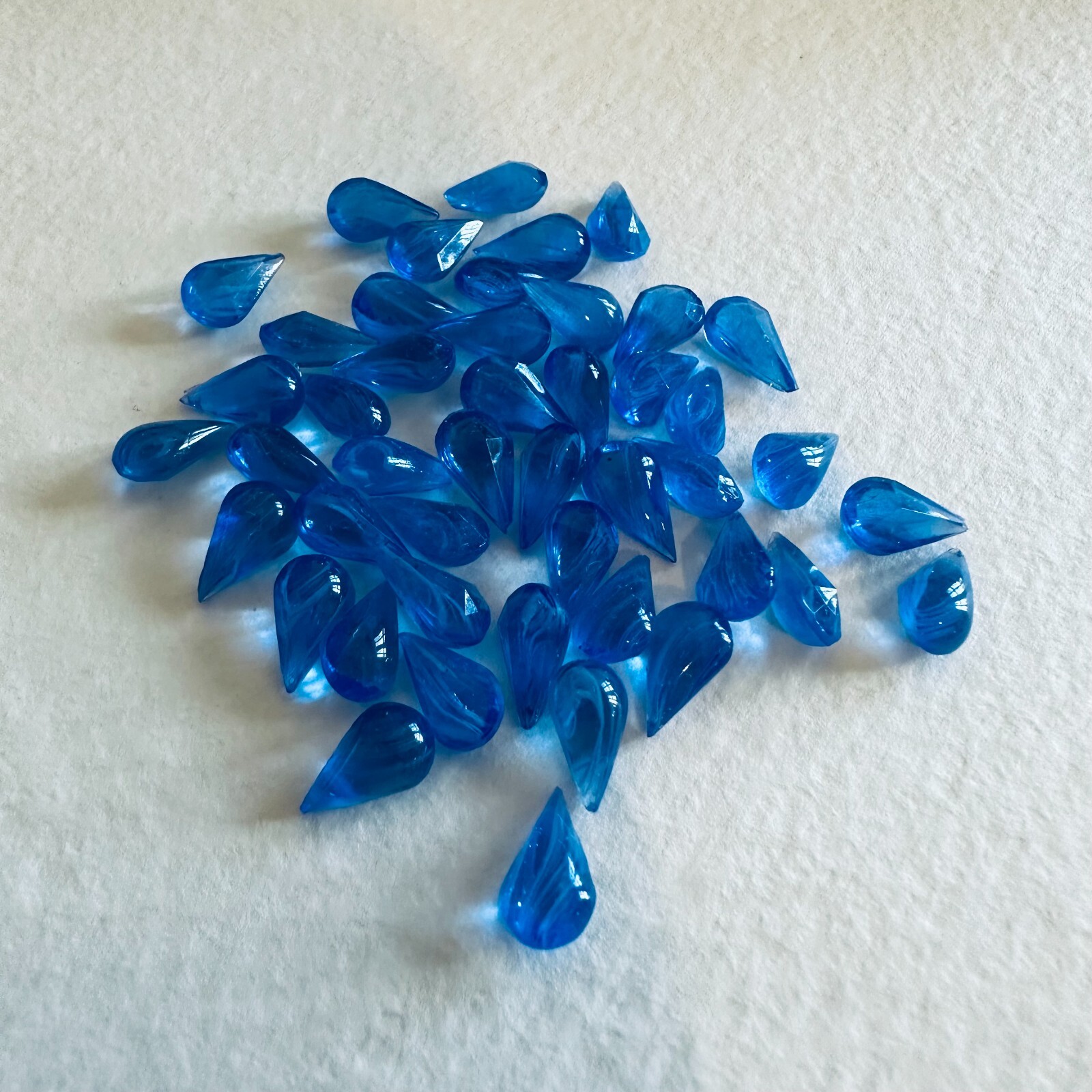 AN969 10x6mm blue “flawed” bombee glass pears, unfoiled (48)