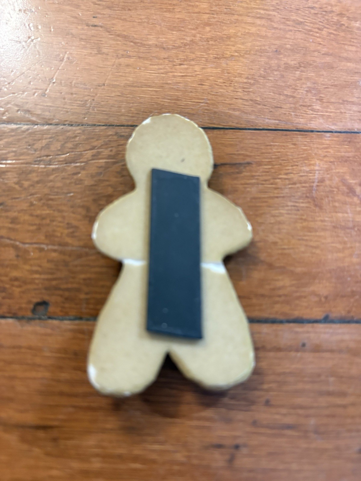 Gingerbread Man Ceramic Magnet/Broke in the Middle and was repaired with glue
