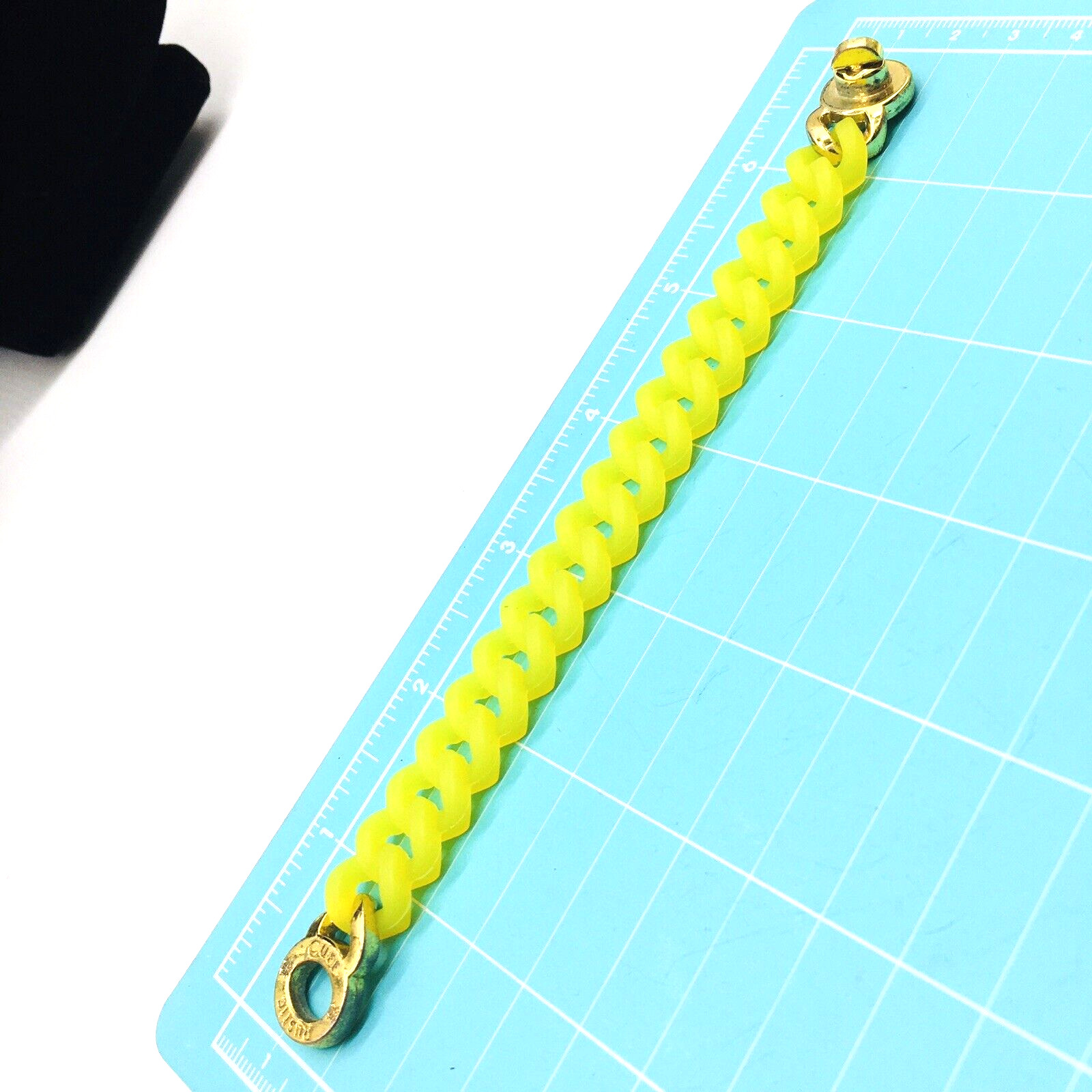 Rustic Cuff Gold Tone Logo Turn Lock Yellow Silicone Stretch Bracelet