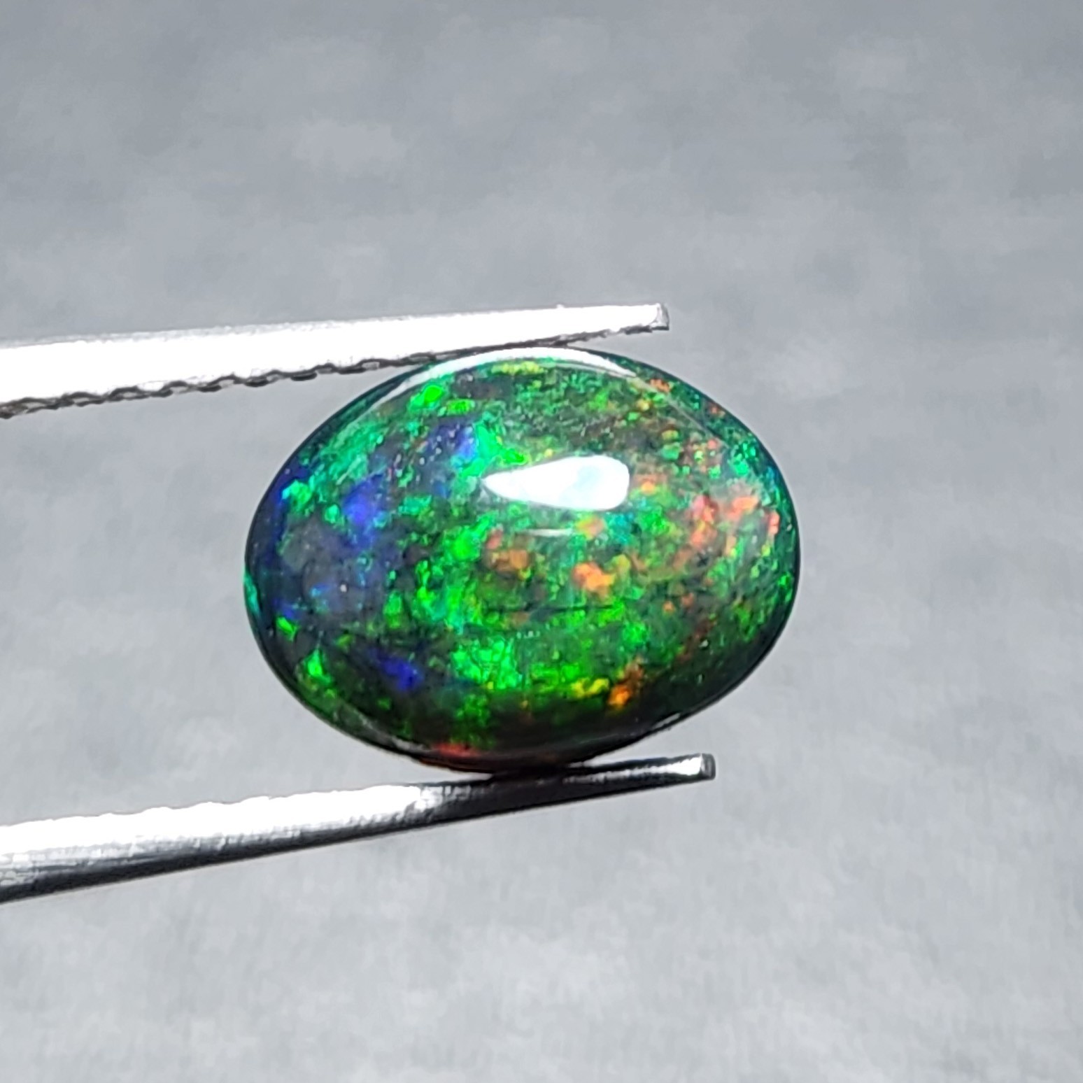 Natural Welo Black Opal Ethiopia Oval Cabochon Vivid Green Fire Gemstone 1.20Ct