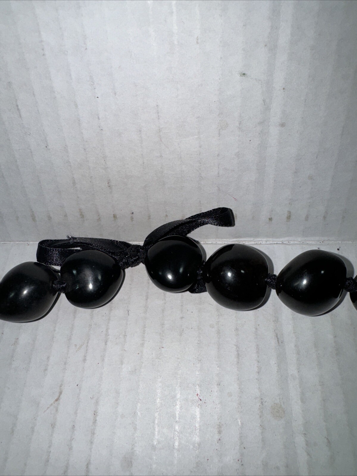 Vintage necklace large dark brown Kukui Nut lei Hawaiiana Black ribbon 12 In.
