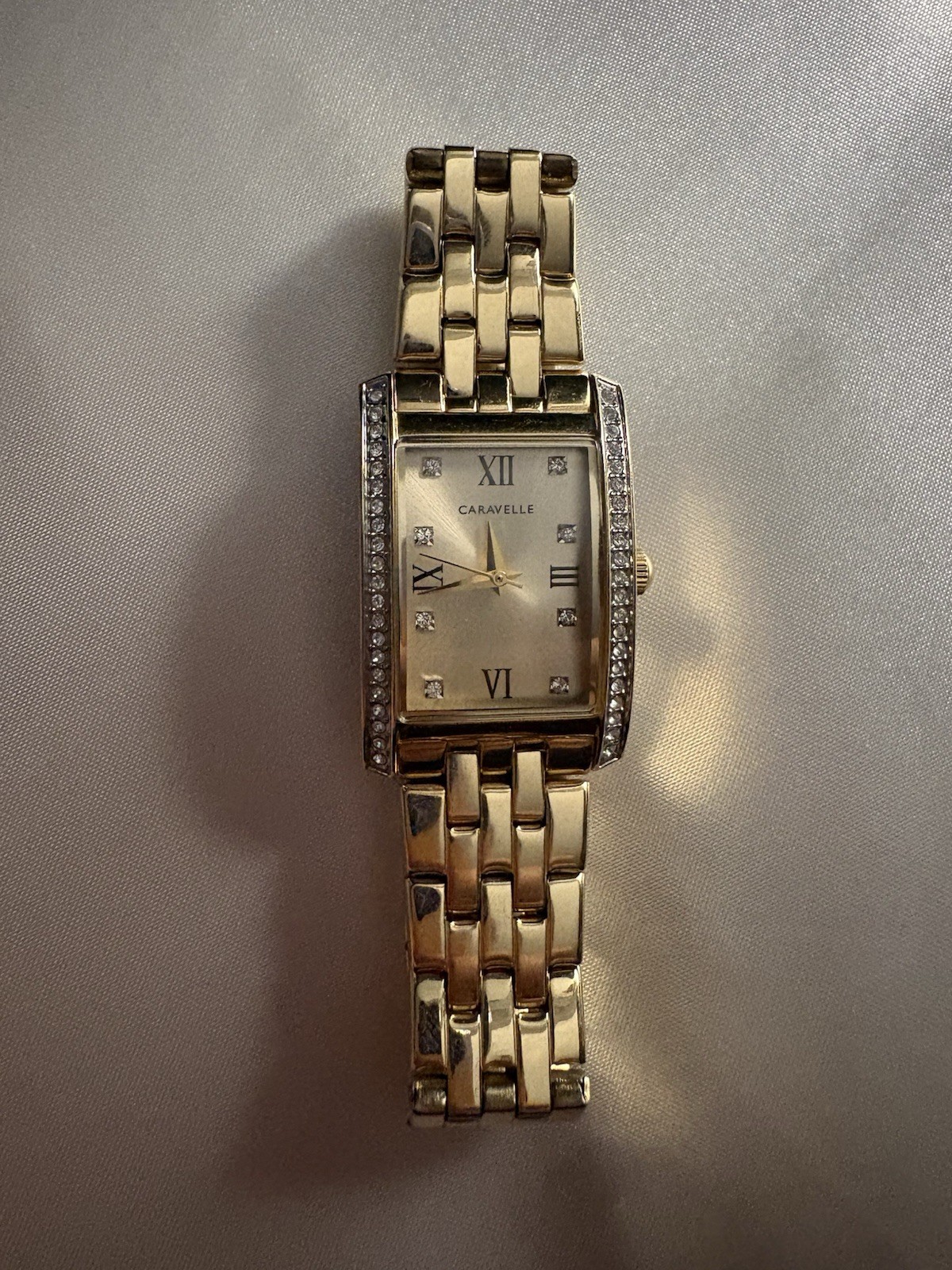 Caravelle Women’s Gold Tone Rectangle Quartz Watch Roman Dial Metal Bracelet
