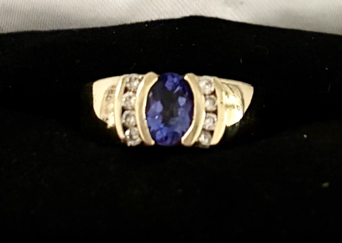 14kt YG Ring w/Oval Tanzanite 17 x 5 mm approx .90 cts w/8 round diamonds RJM