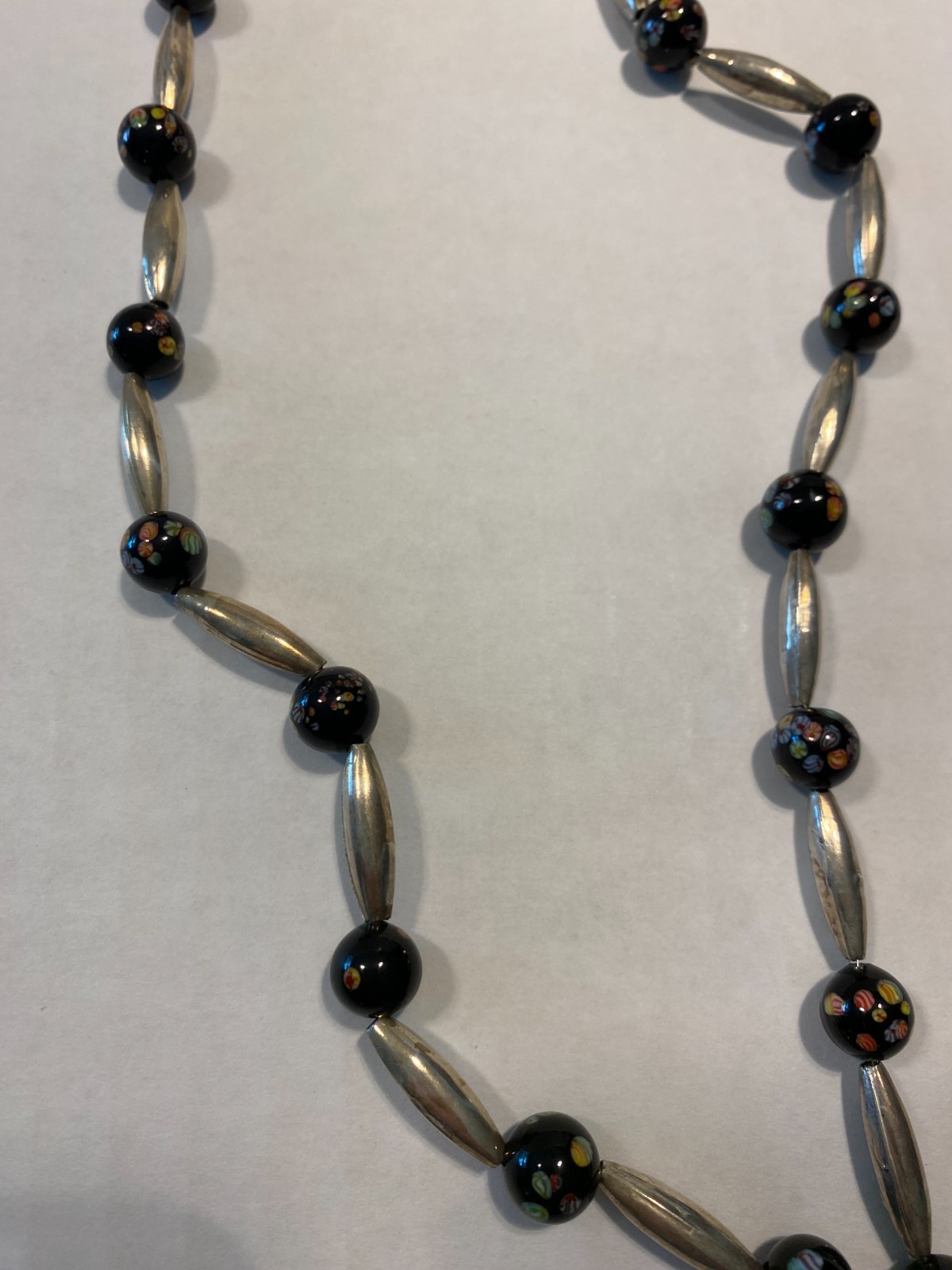 Italian glass millefiori and silver beaded necklace. Medium length.